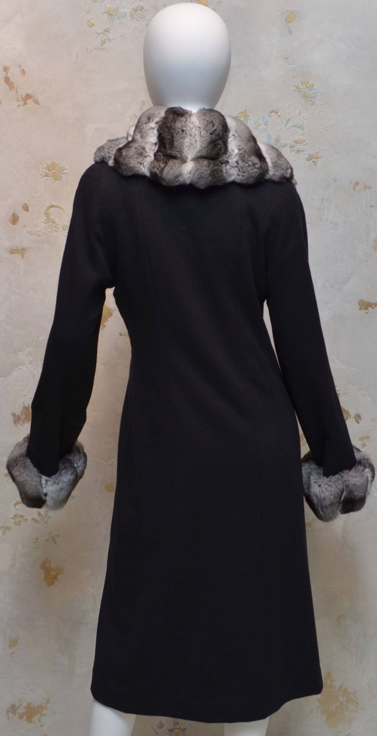 Loro Piana cashmere coat features a chinchilla fur trim along the collar and cuffs, button closures along the front, fully lined, pockets at the hips, and is 100% cashmere. 

Measurements:
Bust - 38''
Sleeves - 28''
Waist - 34''
Hips -