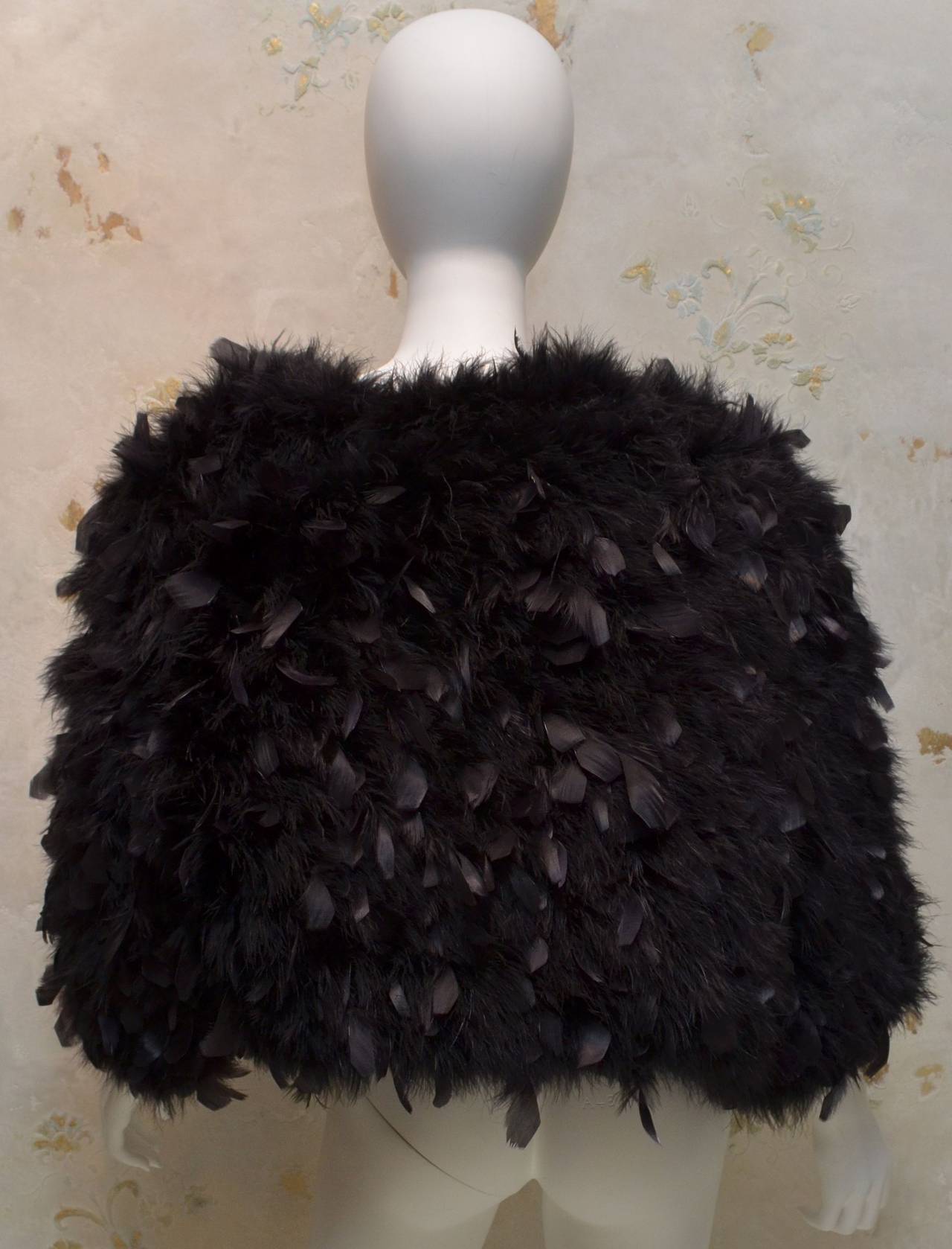 Turkey feather jacket is fully lined and made in Macao.

Measurements:
Bust - 48''
Sleeves - 23''
Length - 19''