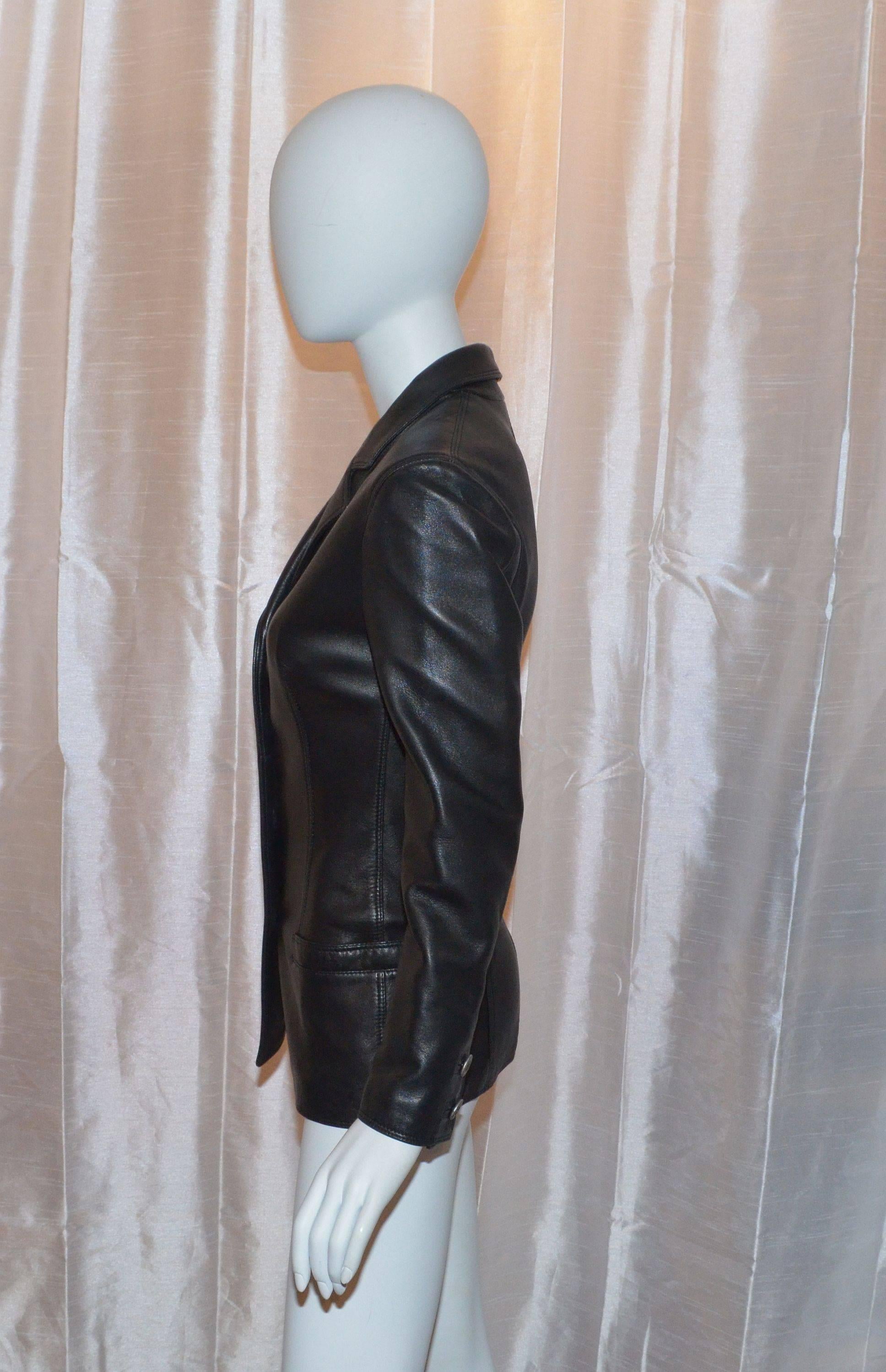 Vintage Gianni Versace leather jacket has silver-tone Medusa button closures along the front center and on the cuffs as well, there are 2 pockets at the waist, made with 100% genuine leather and lined in 100% rayon.  Made in