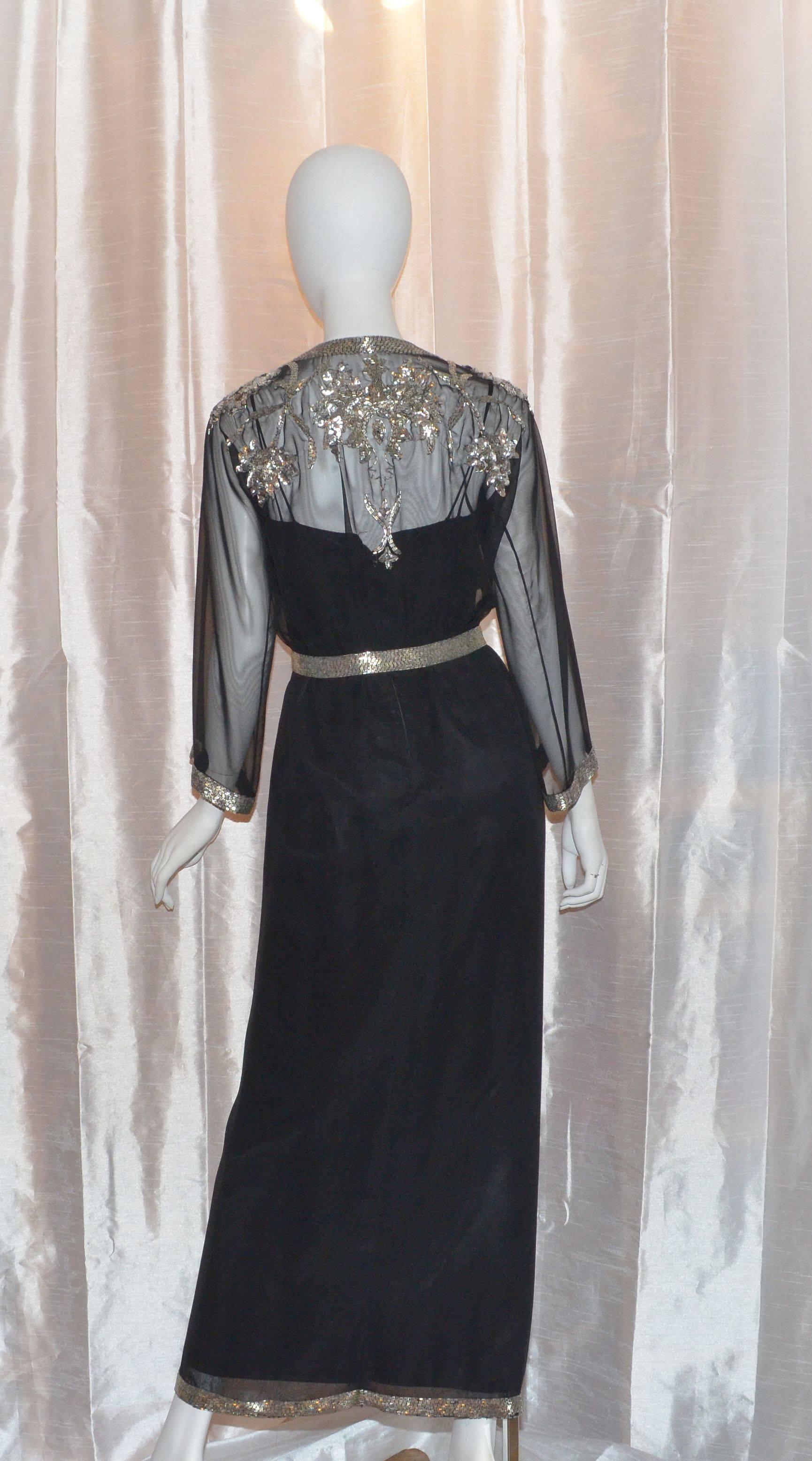 Michael Novarese Sheer Sequin Beaded Slit Front Gown and Jacket of exquisite quality and construction

Vintage Michael Novarese ensemble features a cropped sheer blouse cover with silver beading and sequin detailing at the front and back, as well