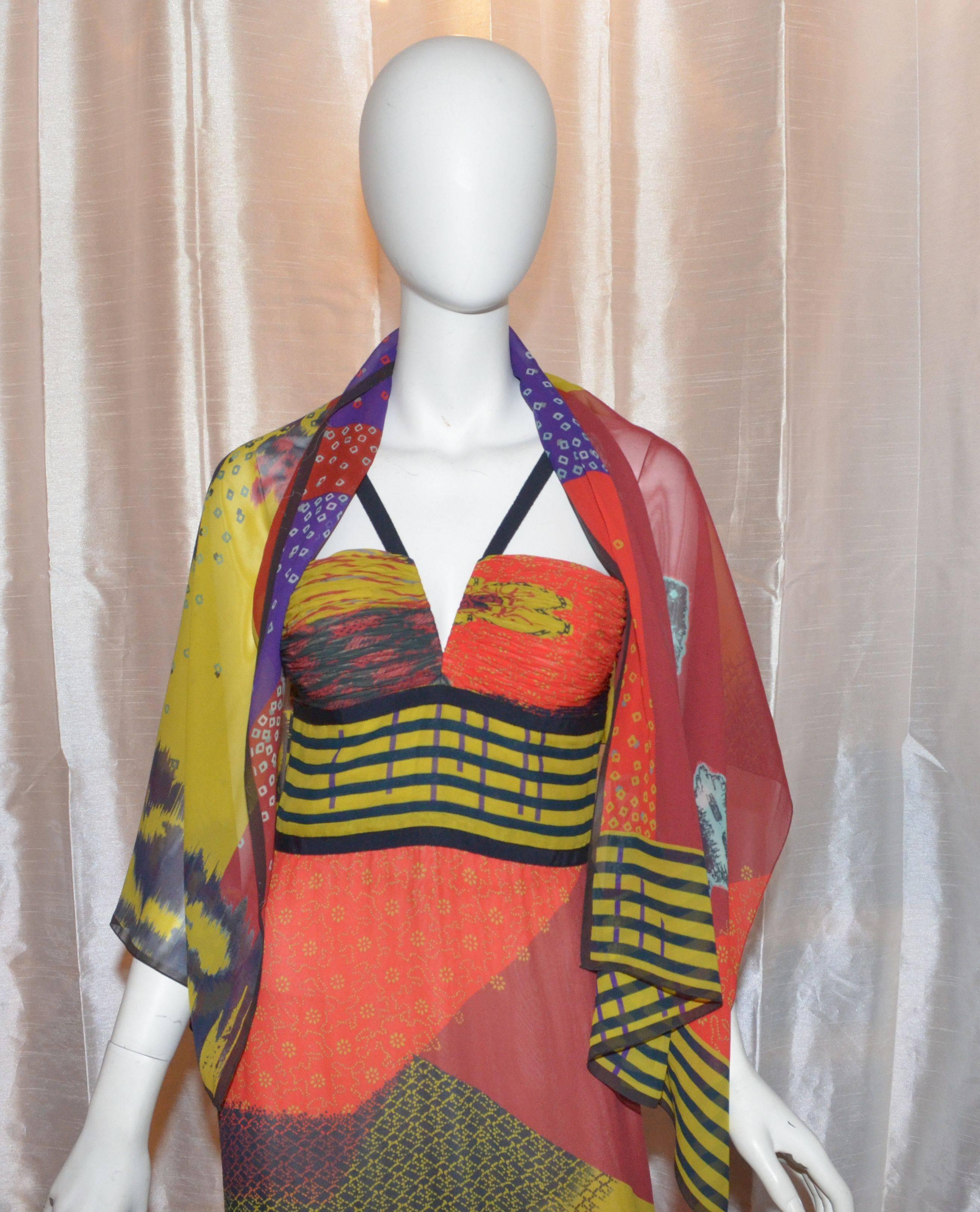 Oscar de la Renta 2008 African Print Silk Chiffon Gown with Shawl

Oscar de la Renta gown features a multi-colored African print throughout a silk fabric with ruching at the bust, flat shoulder straps, back zipper and hook-and-eye fastening,