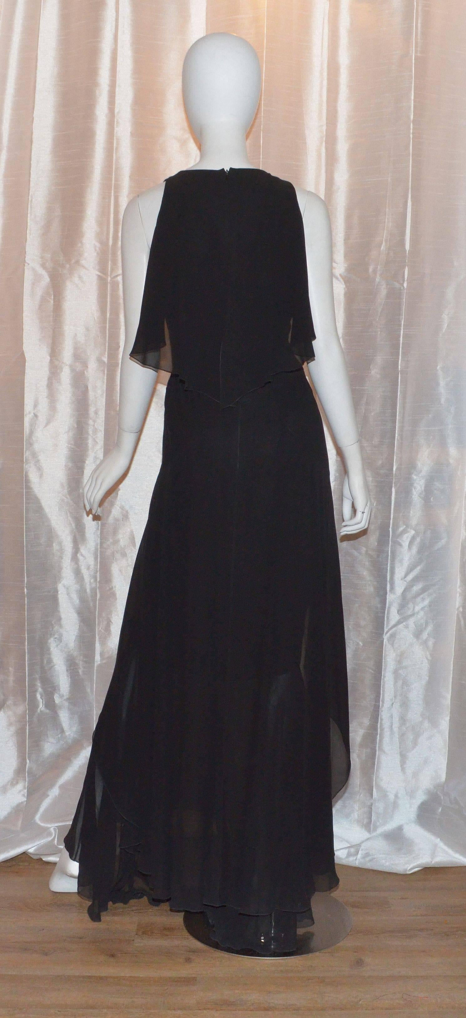 Chanel silk chiffon gown from 2006 Fall collection is a size 40. Dress is 100% silk with a V-neckline, front of the dress creates the illusion of a tulip-hem lining, silk ruffle layering at the bust that follows to the back and layering on the low