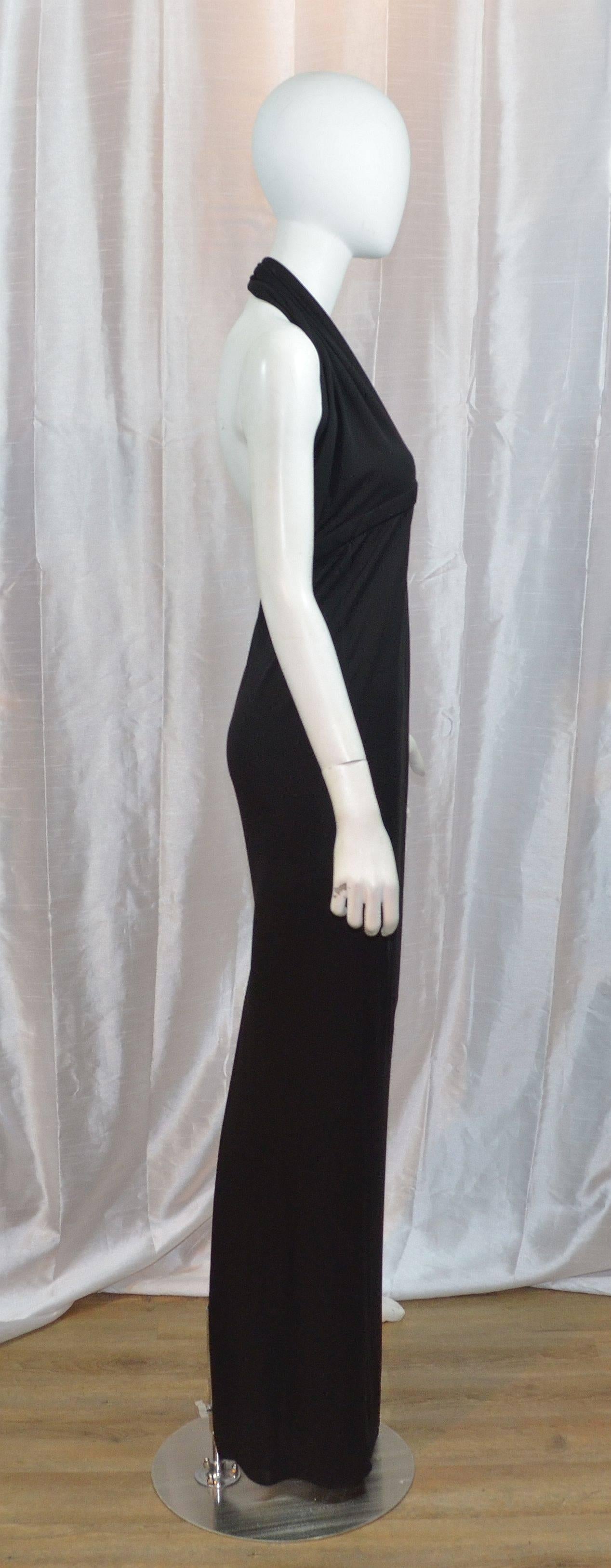 Gucci Black Jersey Dress Halter Neck Maxi Gown

Gucci halter gown is made with 100% rayon jersey fabric, made in Italy. Dress is labeled a size L but fits smaller so please see measurements. Back zipper and hook-and-eye fastening. Dress also