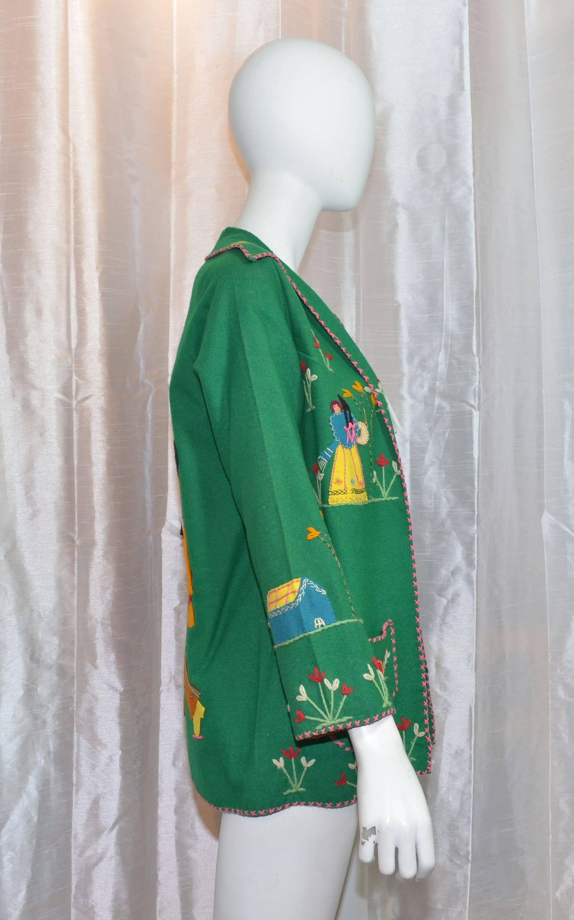 Vintage jacket features a knitted image of a mother and daughter at each side of the bust, sombreros on the front slip pockets, and a knitted image of Mexican folkloric dancers wearing traditional costumes at the back. Back of the jacket has some