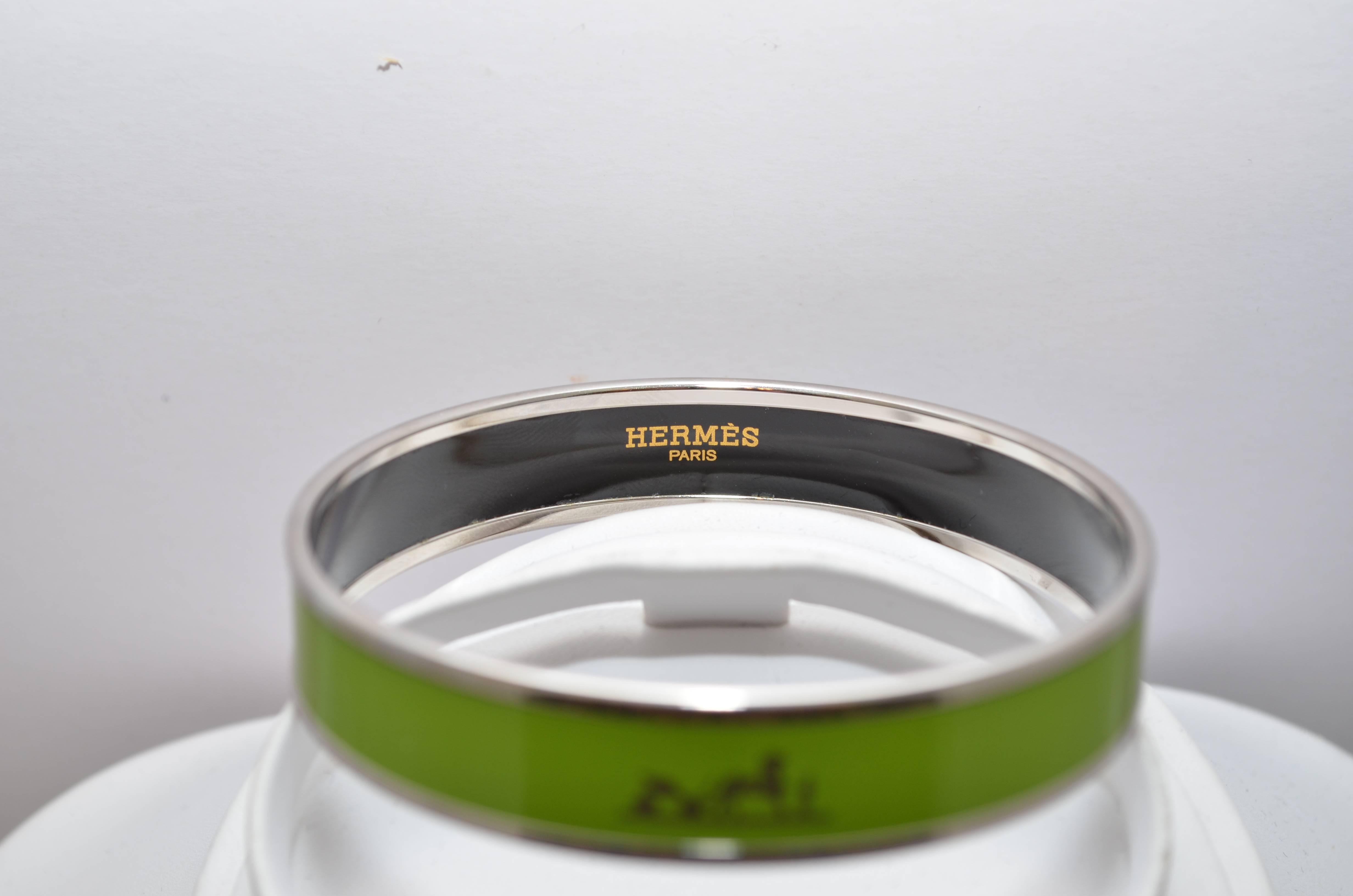 Hermes Paris Lime Green Enamel Equestrian Horse Print Logo Bangle Bracelet 62cm Small size Hermes Paris bangle in a lime green enamel with the horse logo in silver, and silver palladium plated metal. Diameter measures 2.5 inches and width is 1