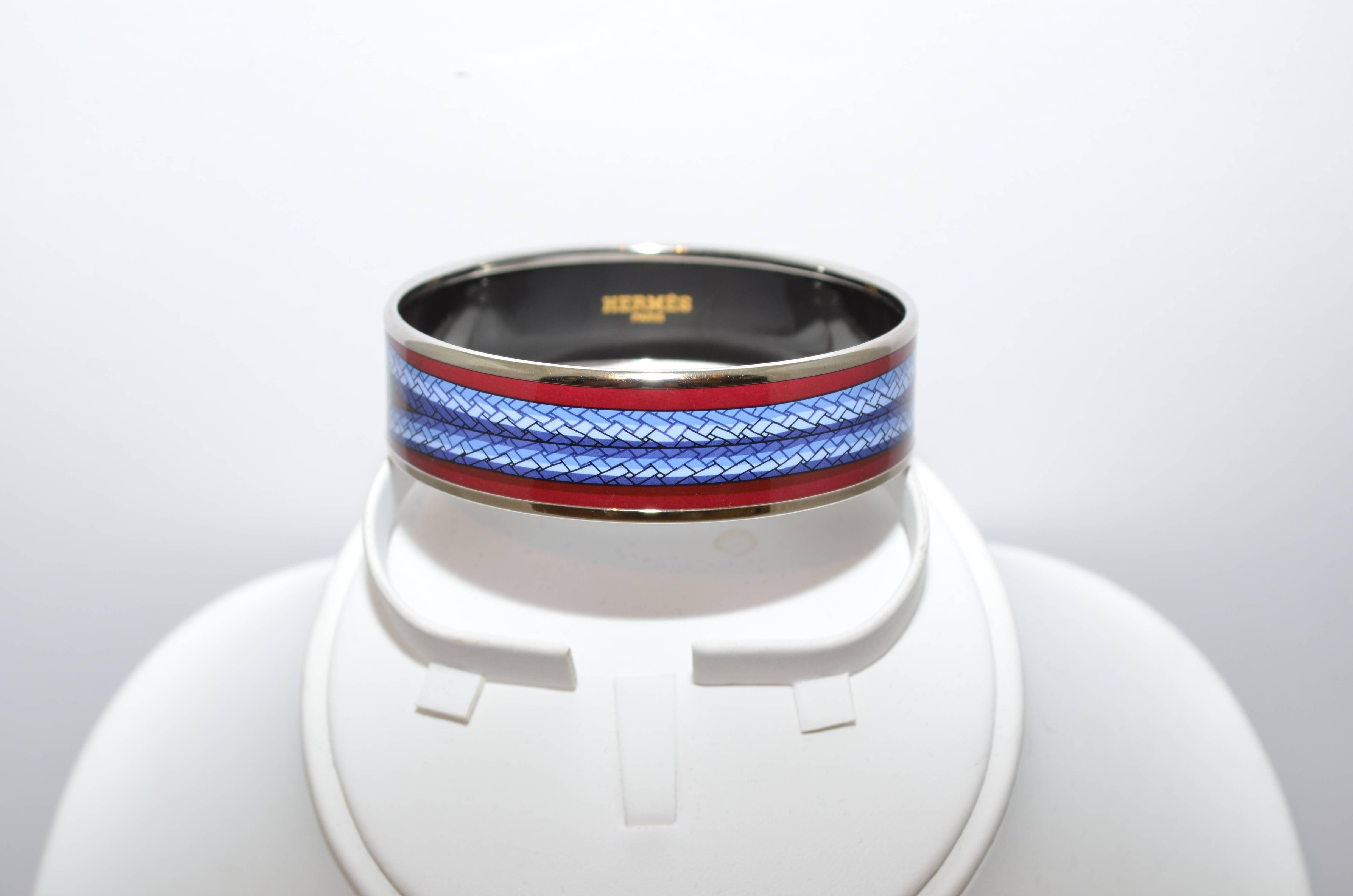 Hermes Paris Palladium Silver Multicolor Printed Enamel Bangle Bracelet Small size 62 Hermes Paris bangle is featured a in a silver-tone metal and has an enamel wrapped rope printed design in maroon, teal, and blue colors. Diameter measures 2.5