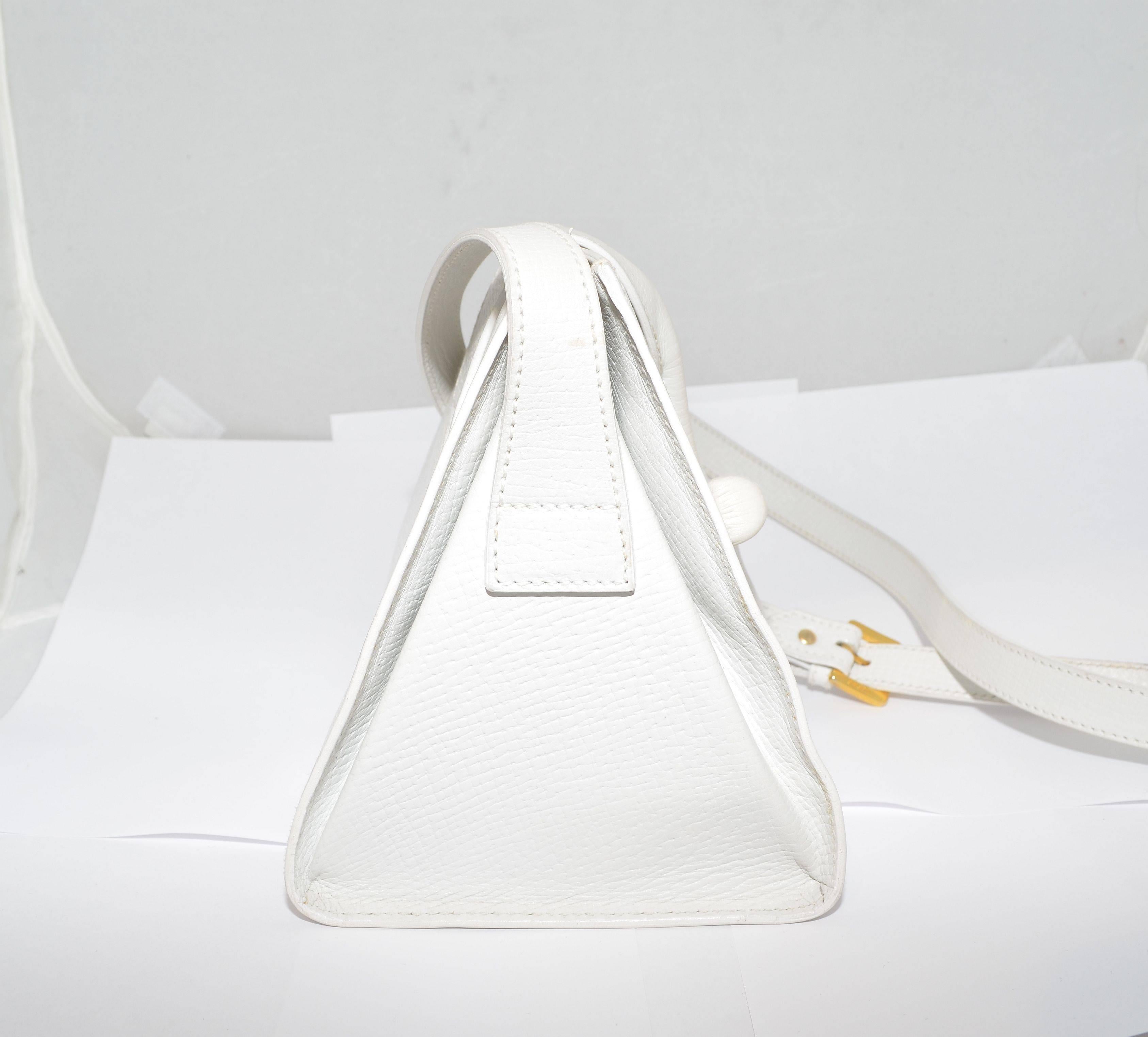 Loewe Vintage White Leather Pyramid Triangle Cross Body or Shoulder Bag

Vintage Loewe leather bag featured in white has a toggle and strap closure at the top, gold-tone buckle to adjust length of the shoulder strap. Bag is leather lined and made