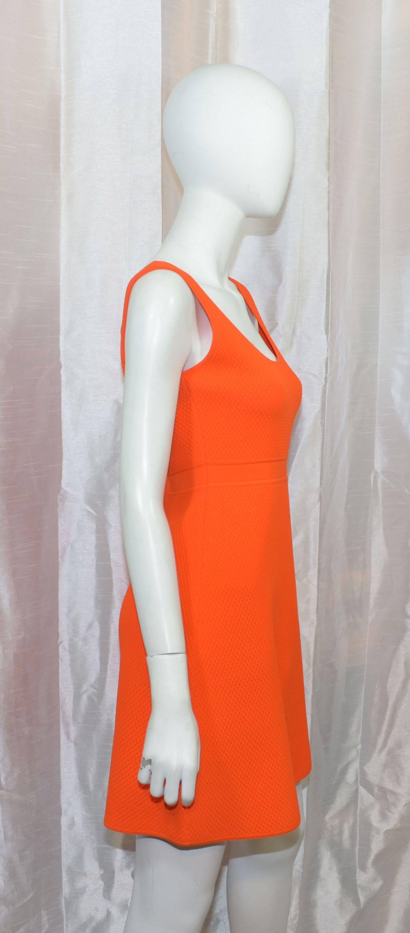 Gucci dress featured in a bright orange waffle knit fabric with a side zipper closure. Dress is a size Medium and made in Italy. 52% rayon, 46% nylon, and 2% elastane. 

Measurements:
bust - 32''
waist - 28''
hips - 36''
length - 29''