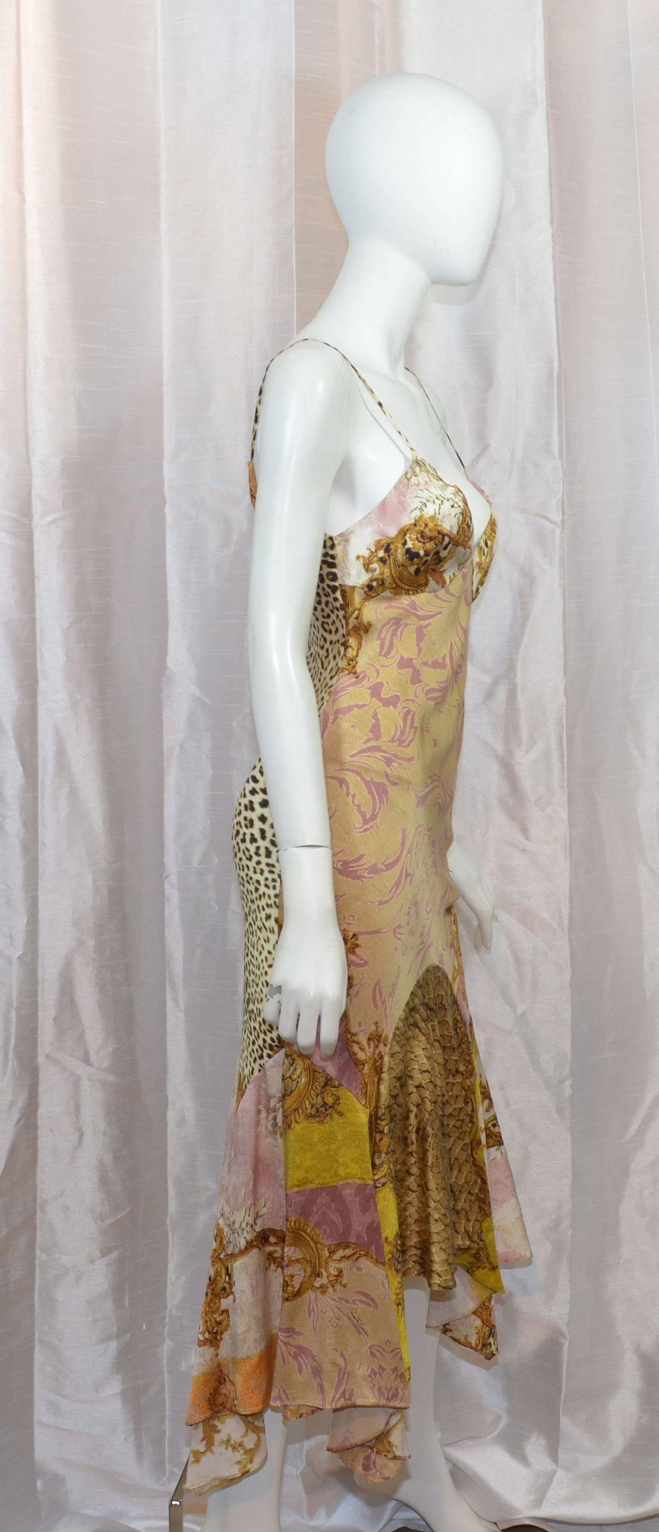 Roberto Cavalli bias cut silk dress features a mixed print throughout, handkerchief hem, 100% silk, labeled size 42, made in Italy.

Measurements:
bust - 32+''
waist - 28''
hips - 34''
length - 41''