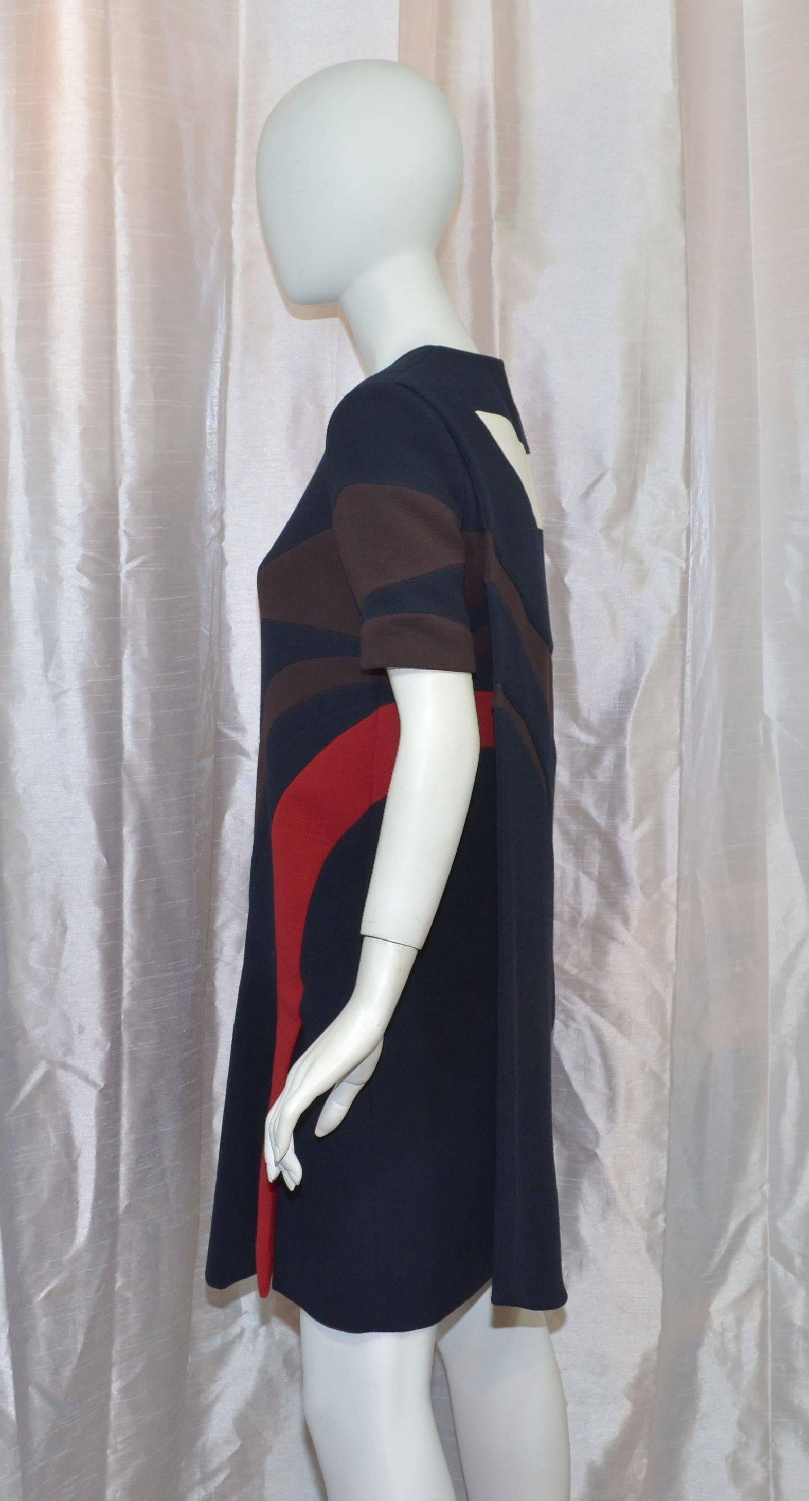 Christian Dior structured wool dress featured in navy blue with brown/red/cream patterning, double-layered back with a zipper and hook-and-eye fastening. Dress is fully lined. Original tags attached. Retail price 4k. 100% virgin wool, 100% silk