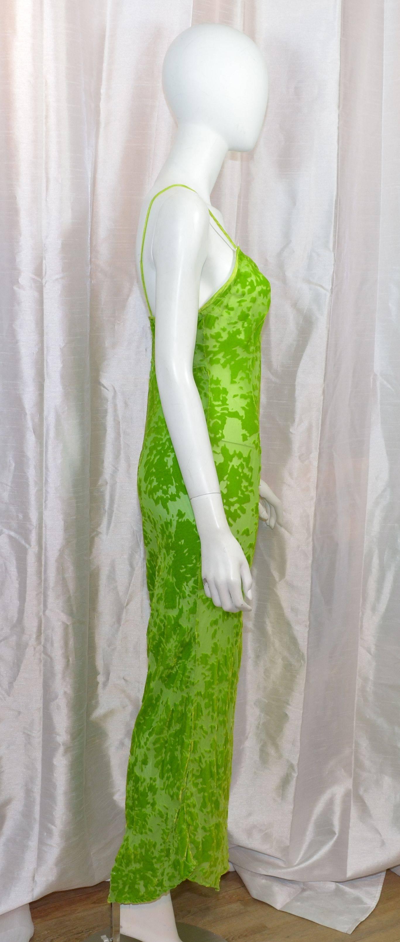 Voyage maxi slip dress featured in a lime green with cut velvet details. Bias cut fabric with a satin trim at the neckline, and satin shoulder straps. Dress is labeled 
