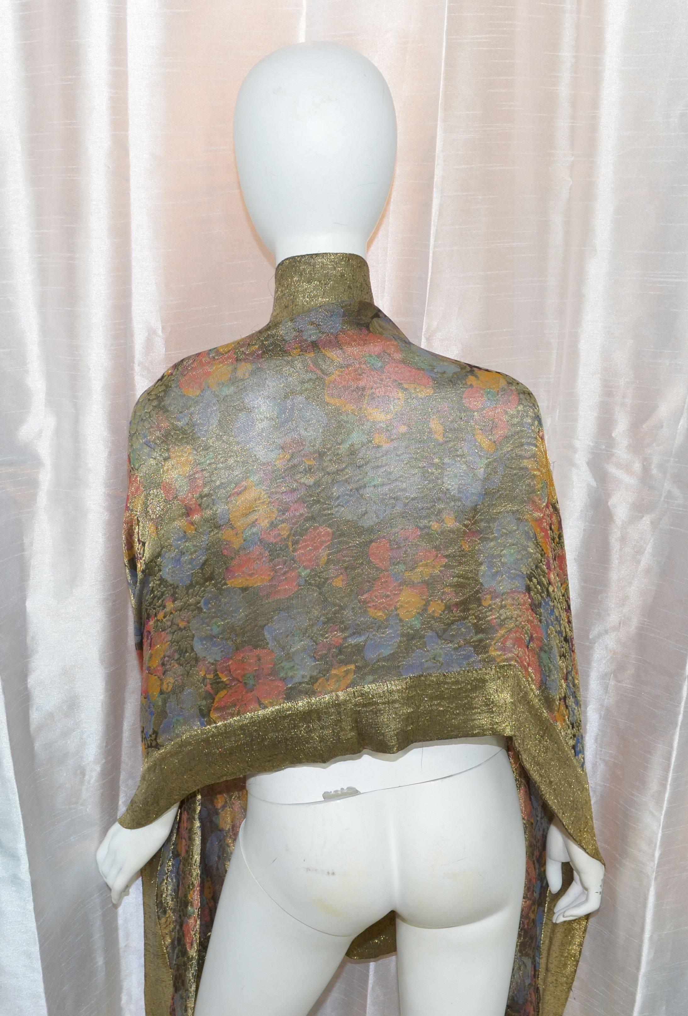 Featured is an exquisite 1920s art deco shawl made of gold 