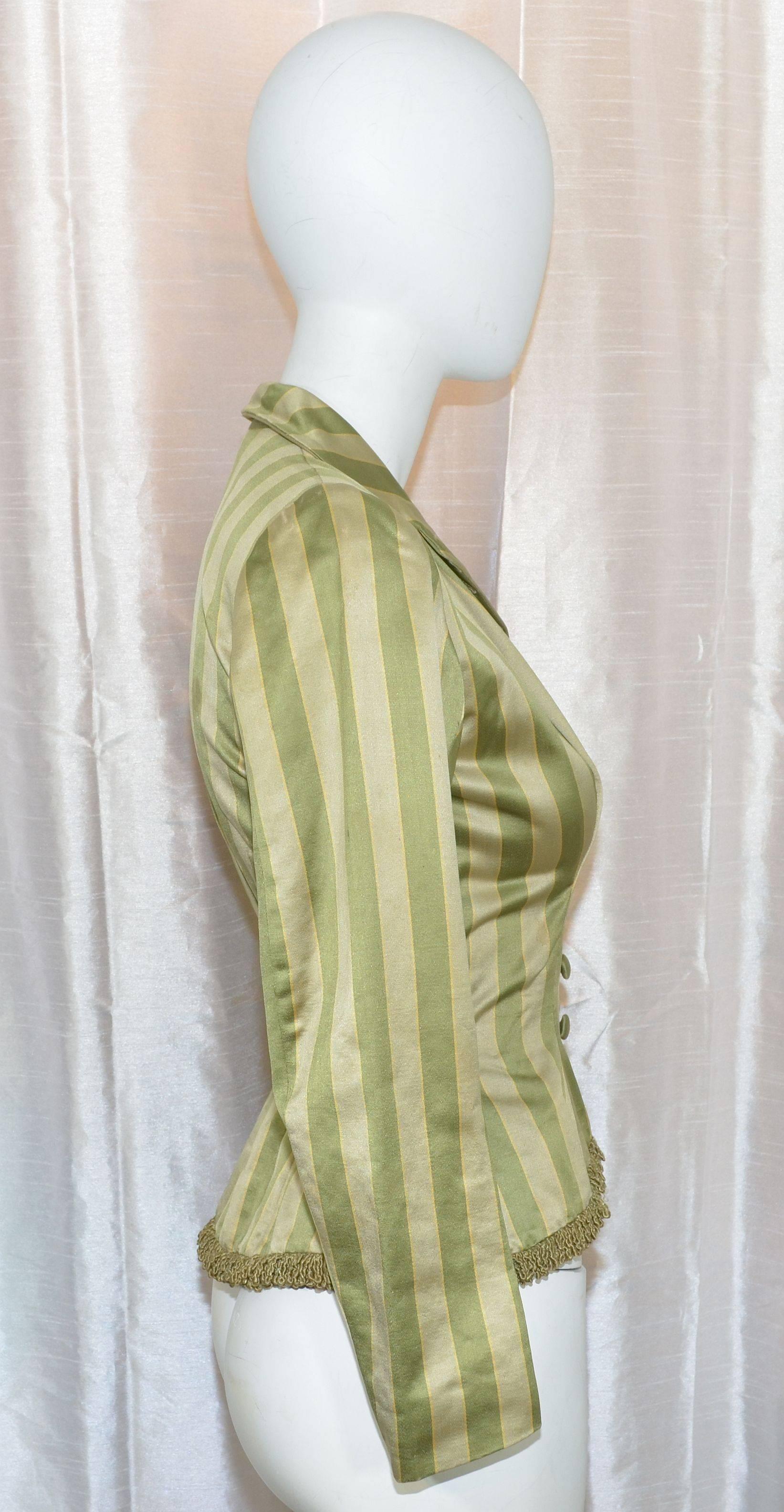 Victorian jacket is featured in an olive/taupe striped pattern, constructed in satin finish fabric with covered button front closures, and a peplum silhouette. Excellent condition considering the age. Fully lined.

Measurements:
bust -