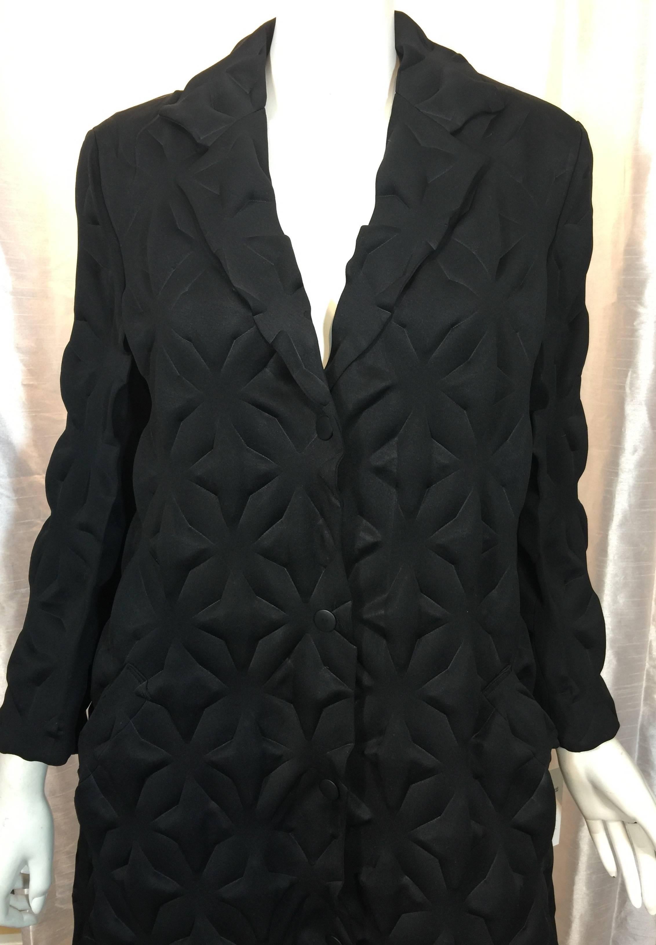 Rare Issey Miyake Black Star Embossed Egg Crate / Egg Carton Unlined Coat with Side pockets and Snap Front Closure

Coat made from black medium weight polyester that has been embossed with a star pattern ( a different and rare version of the coat