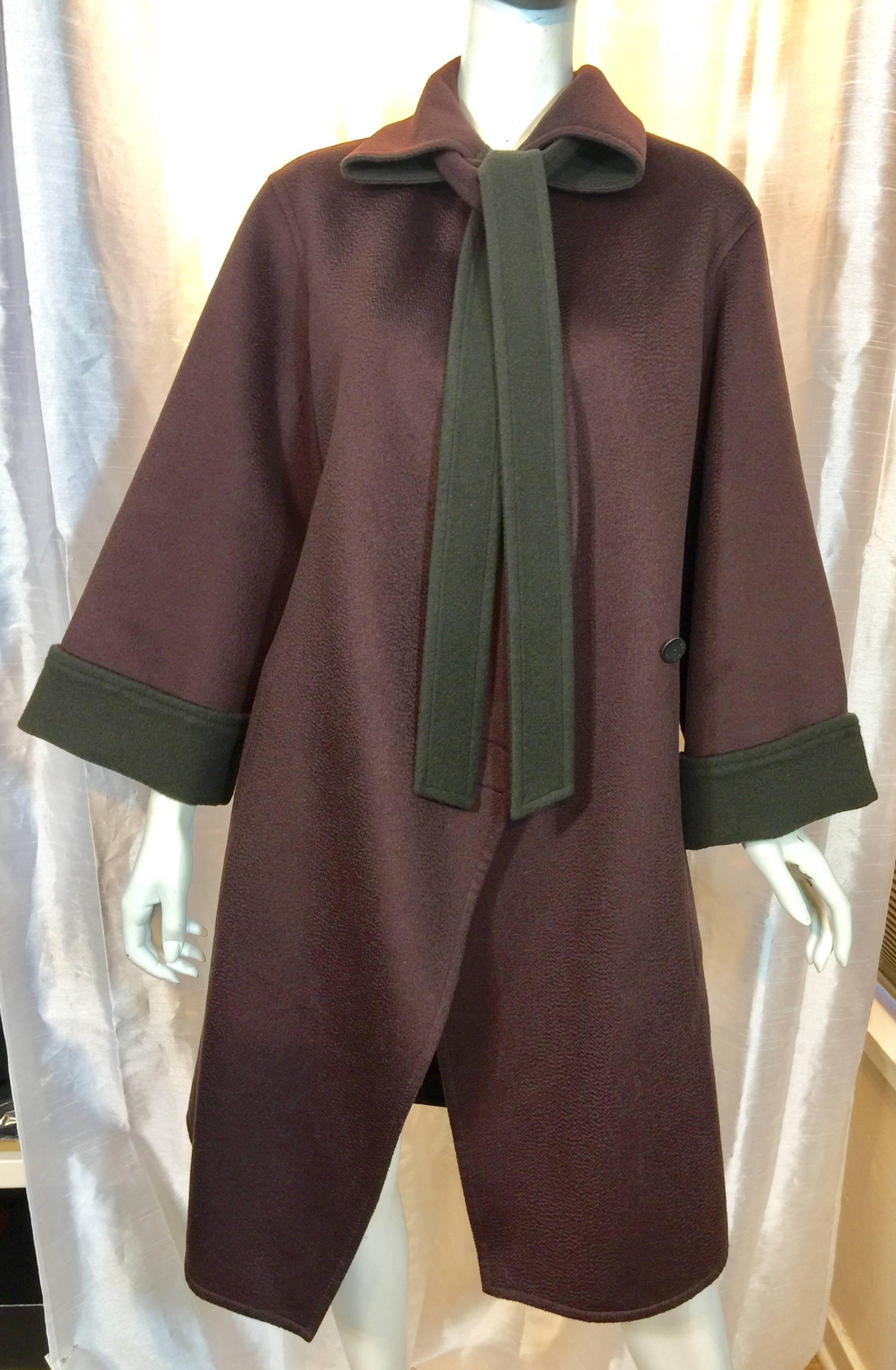 Hermes Versatile (can be worn many ways) Double Faced Cashmere Coat 

Hermes overcoat in burgundy cashmere with a double faced gray/brown reverse side. Welted seams,  belt has burgundy and gray/brown sides. Belt can be worn at waist or in collar
