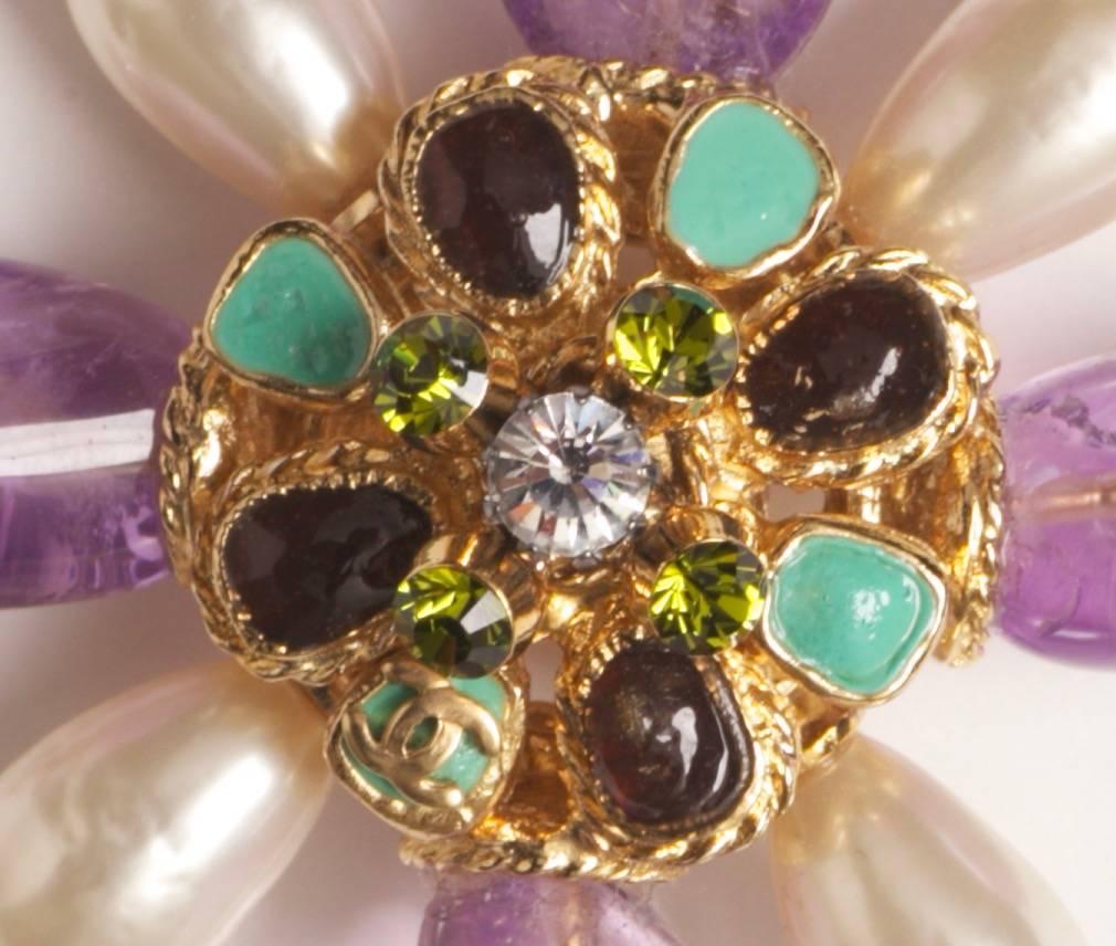 Chanel 2005 Amethyst, Pearl & Gripoix Convertible Pendant or Brooch

Impressive XL Chanel brooch or pendant with 4 large polished amethyst  stones in a starburst or cross pattern. Gripoix poured glass and crystal stones in the center and at the