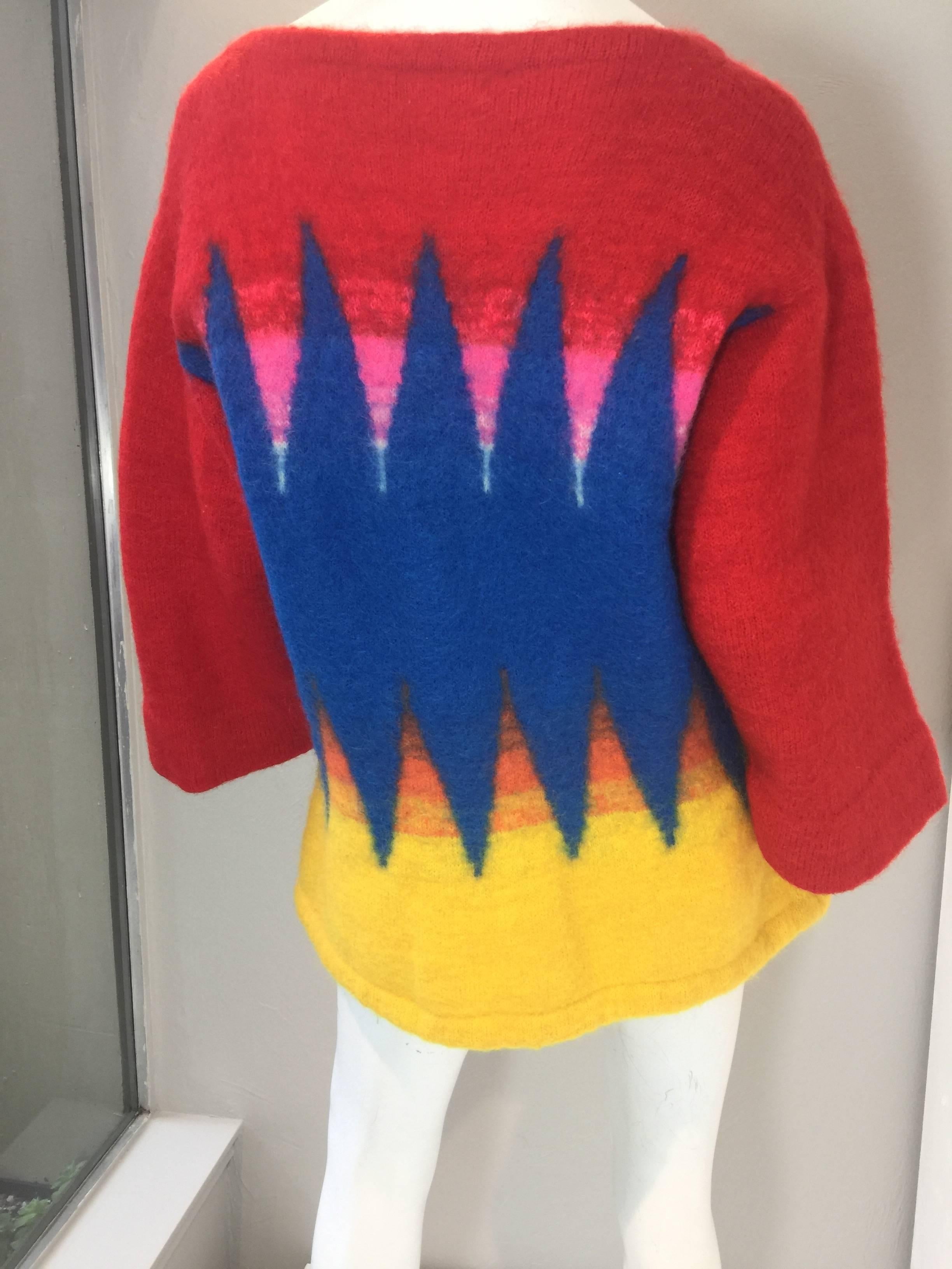 Kansai Yamamoto Boiled Wool Sweater with Bold Graphic Print in Primary Colors

Excellent condition. Fabric content 77% wool, 23% mohair. Made in Japan. Crew neck, long sleeve and drawstring waist.  

Measurements: 
Shoulder - 20