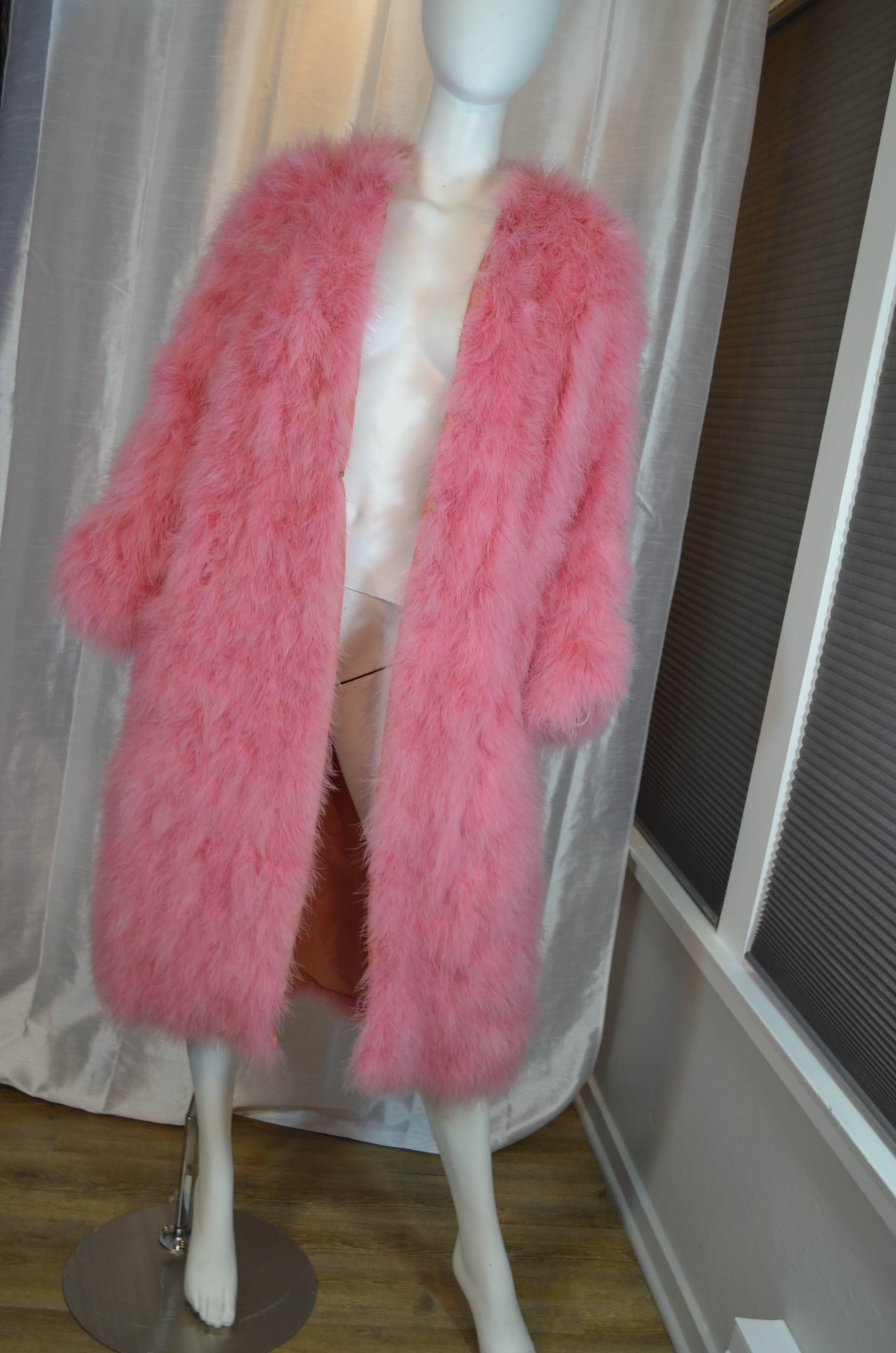 Vicky Valere Parisian designed Maribou Turkey Feather Coat sold by Giorgio Beverly Hills. Pink feather outer coat is lined in matching pink rayon. Collarless with pink hook and eye closures down the front. French size medium. Excellent vintage