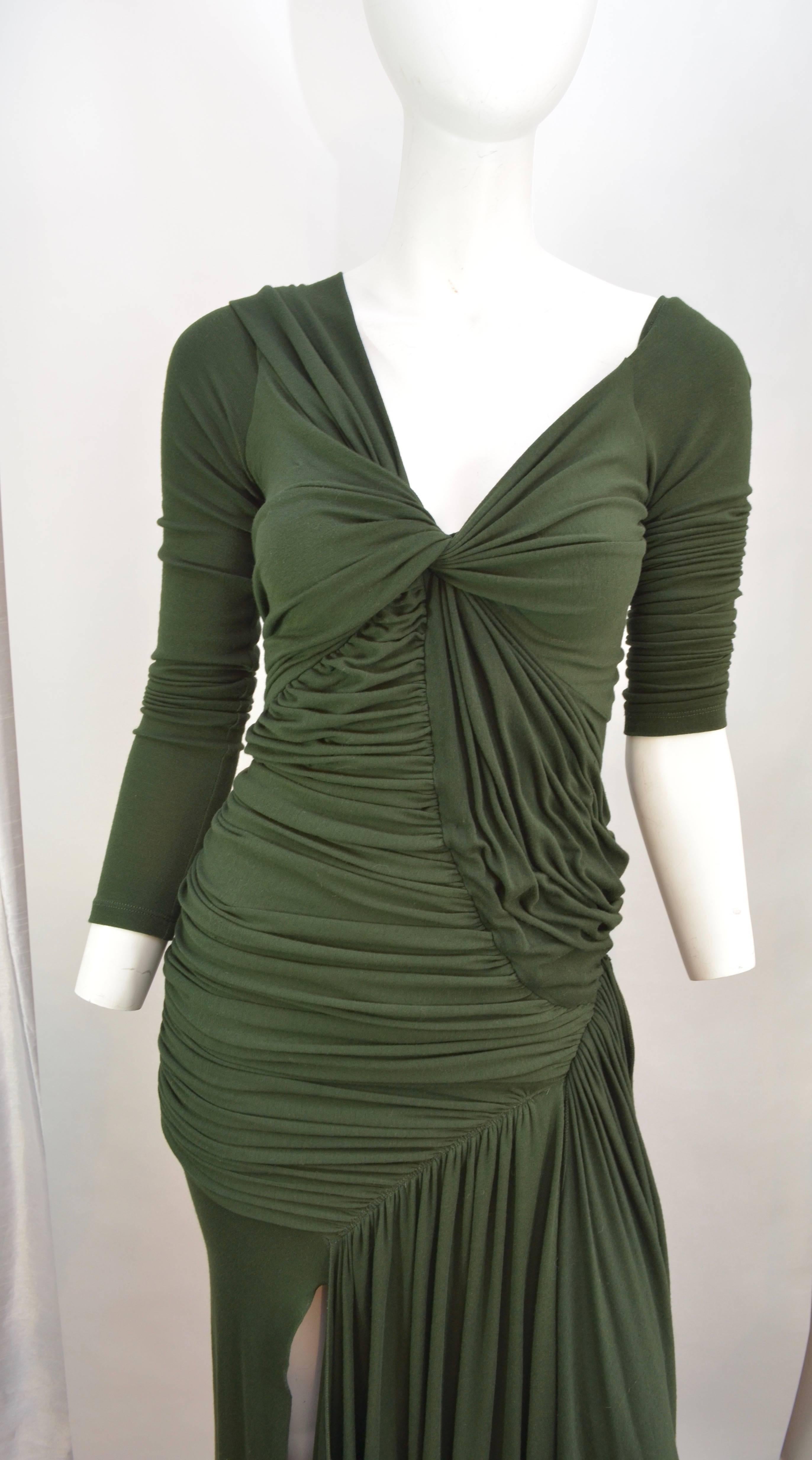 Donna Karan black label ruched evening dress with long sleeves, V neckline and slit up the right leg. Hunter green rayon jersey that is matte and feels like cotton has been ruched and draped in the most flattering way. Dress is in excellent