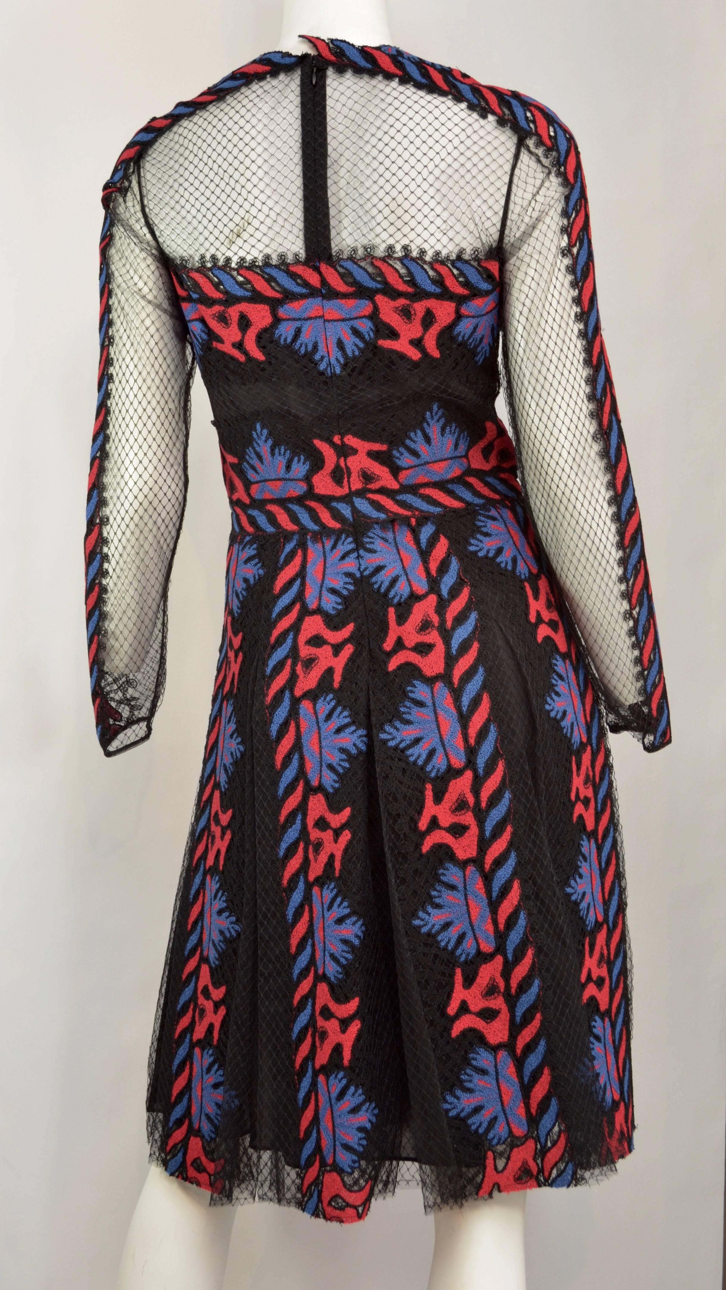 Valentino Mesh Embroidered Runway dress from the Spring 2014 Collection. Black tule mesh dress embroidered with red and blue fluid design. Mesh  sheer panels throughout, long sleeves, crew neck, pleating accents at skirt and concealed zip closure at