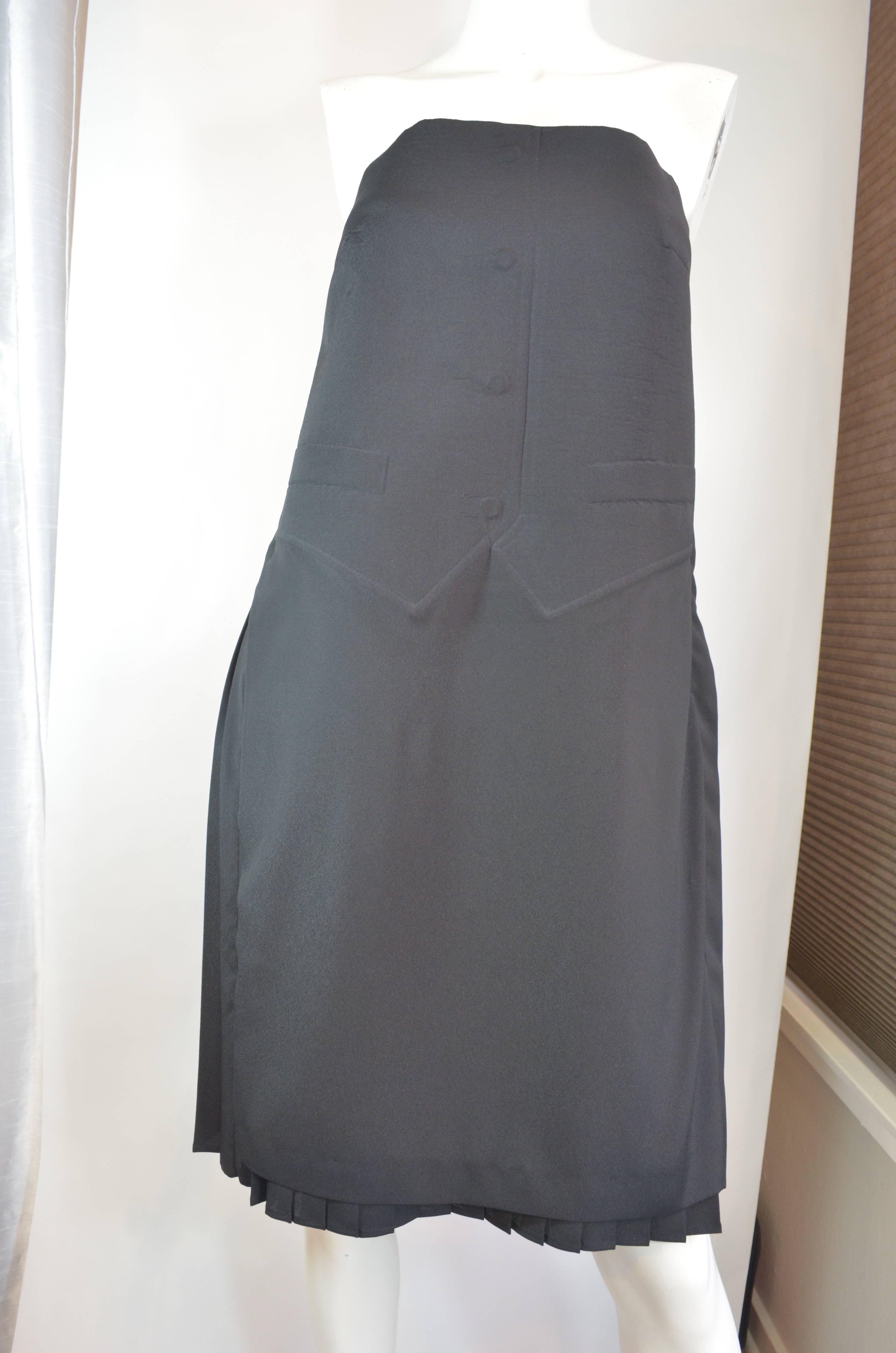 2014 Maison Martin Margiela strapless cocktail dress with embossed vest.  The bodice of the dress is embossed with a tuxedo style vest imprint and the front of the skirt is flat.  The left side of the dress has a zip.  The back of the skirt is