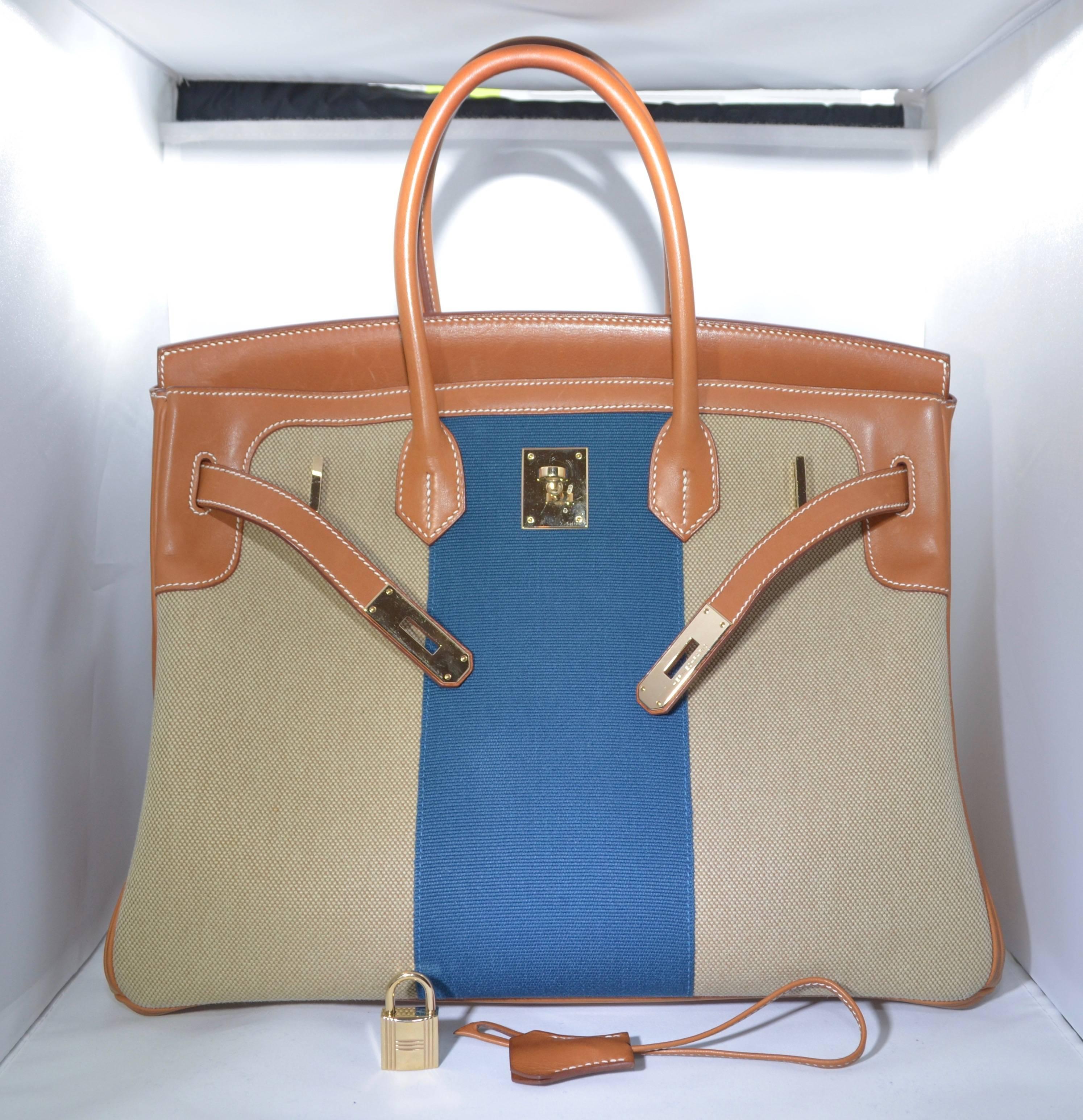 Hermes 2015 Limited Edition 35 cm Flag Birkin, Blue Toile Stripe, Barenia Leather Trimmings, Permabrass Hardware. 

Gently used condition. The Barenia leather is gorgeous yet it marks easily. The bag has a couple of spots on the bottom and some
