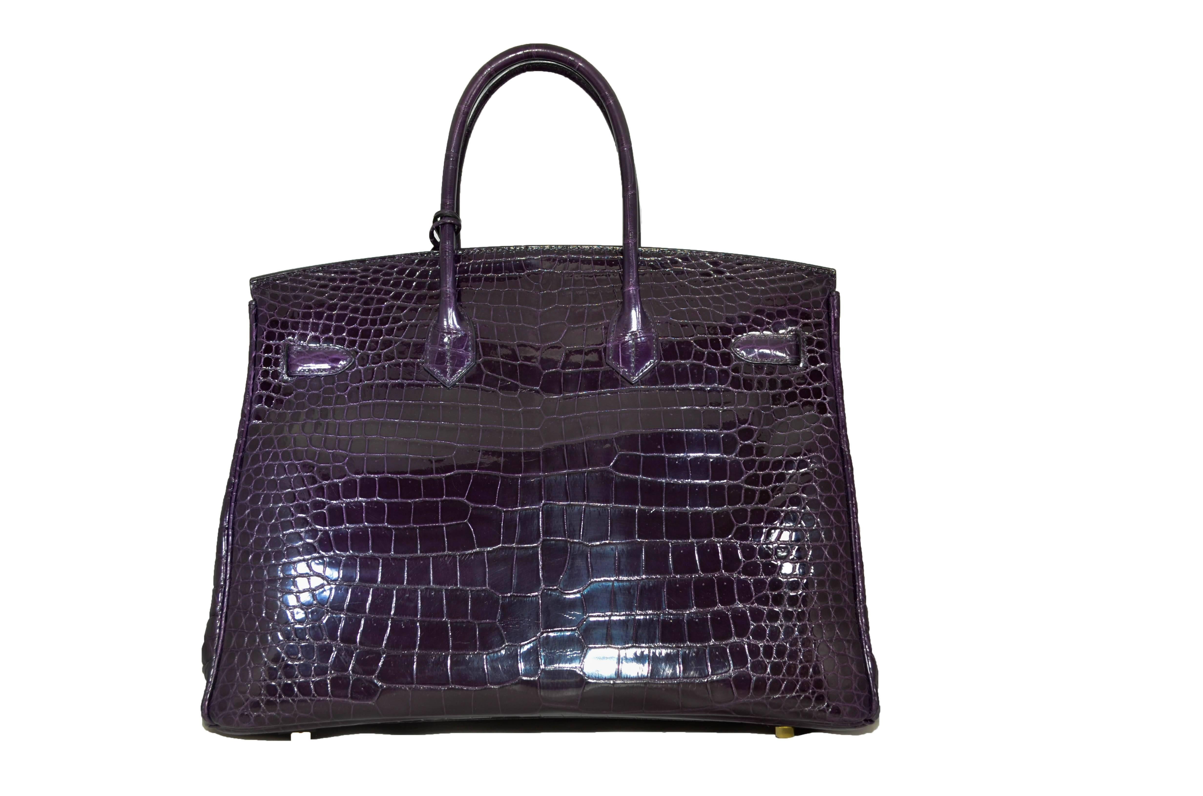 Exquisite Amethyst Hermes Porosus Crocodile Birkin in pristine pre-owned condition. Featuring lavish gold hardware and a lush jewel tone, this mint-condition bag comes with lock, keys in the clochette, sleepers, raincoat, and signature Hermes box.