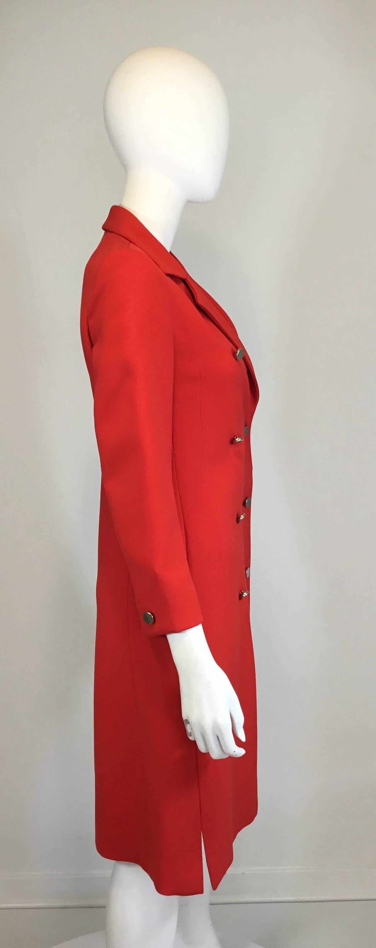 Vintage Givenchy Nouvelle Boutique 1970's coat in the most divine color of red, featuring silver-tone metal button closures along the front in additional to identical buttons at the cuffs in which are for soley for decorative purposes,  full lining.