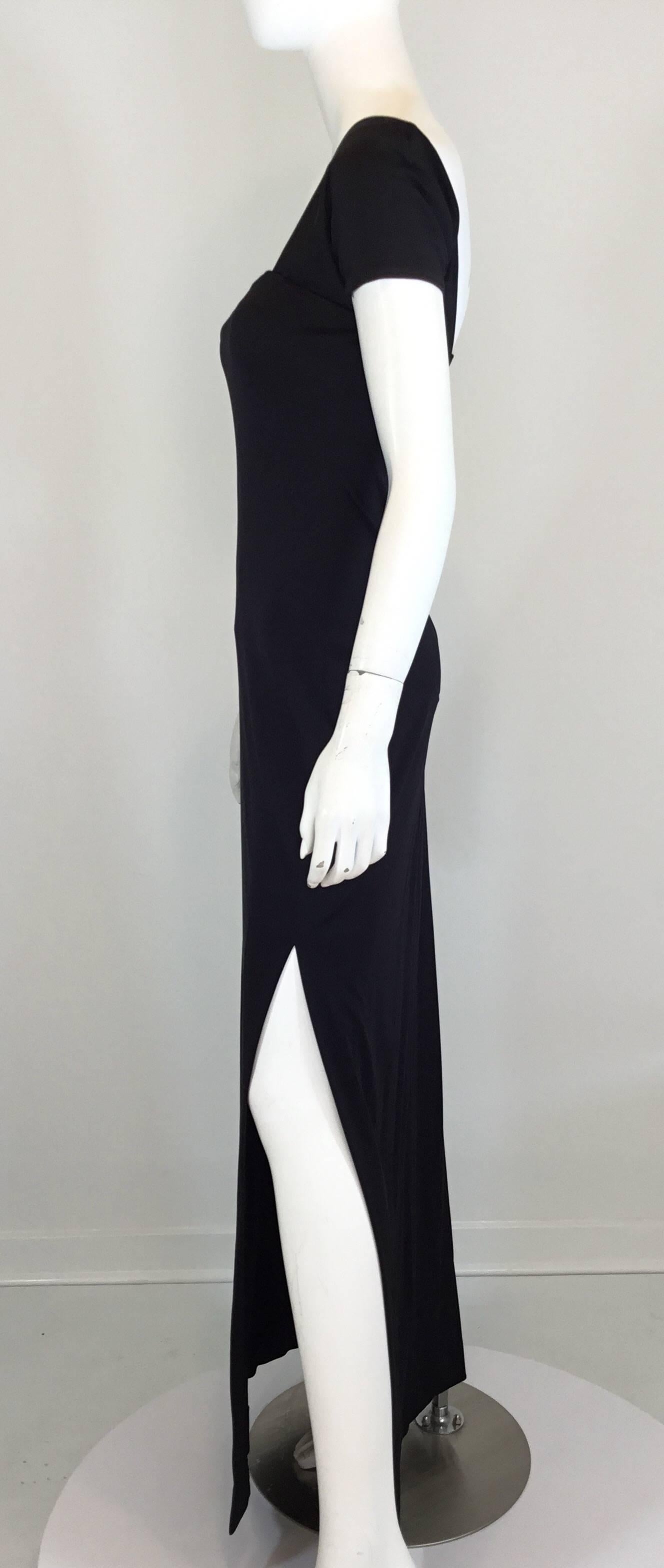 Rudi Gernreich synthetic stretch jersey maxi dress features a one-shoulder modernist design, back zipper fastening, and a slit along the left side of the hem. Labeled Rudi Gernreich for Bob Cunningham. 

Synthetic jersey has stretch:
bust 30'',
