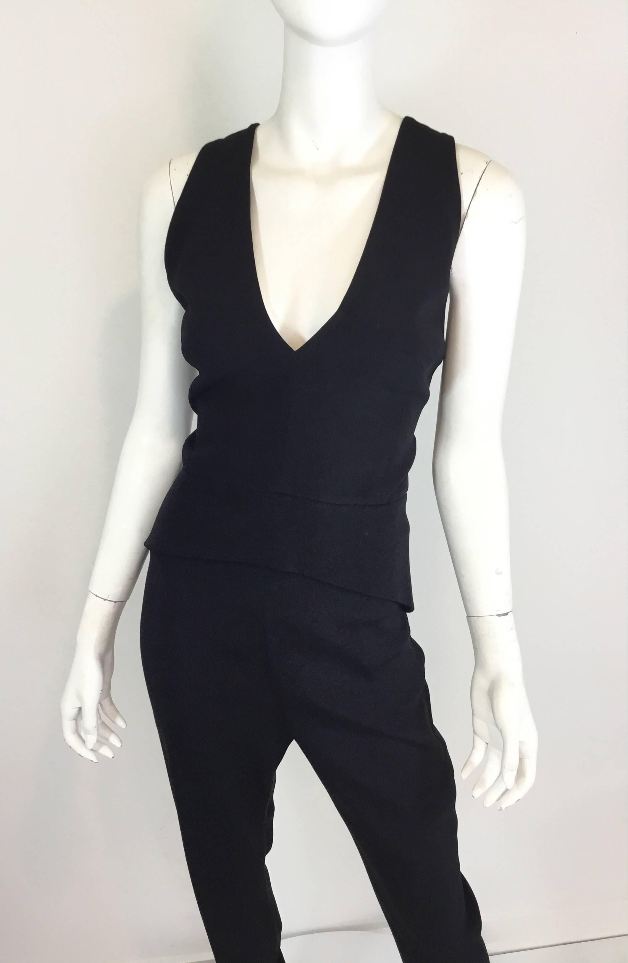 Brandon Maxwell jumpsuit is new with tags and a size 6. Jumpsuit features crossover straps at the back with button fastenings, a back zipper closure, and peplum waist. 

Bust 34'', waist 28'', hips 36'', inseam 31'', length 49''(back center to hem)