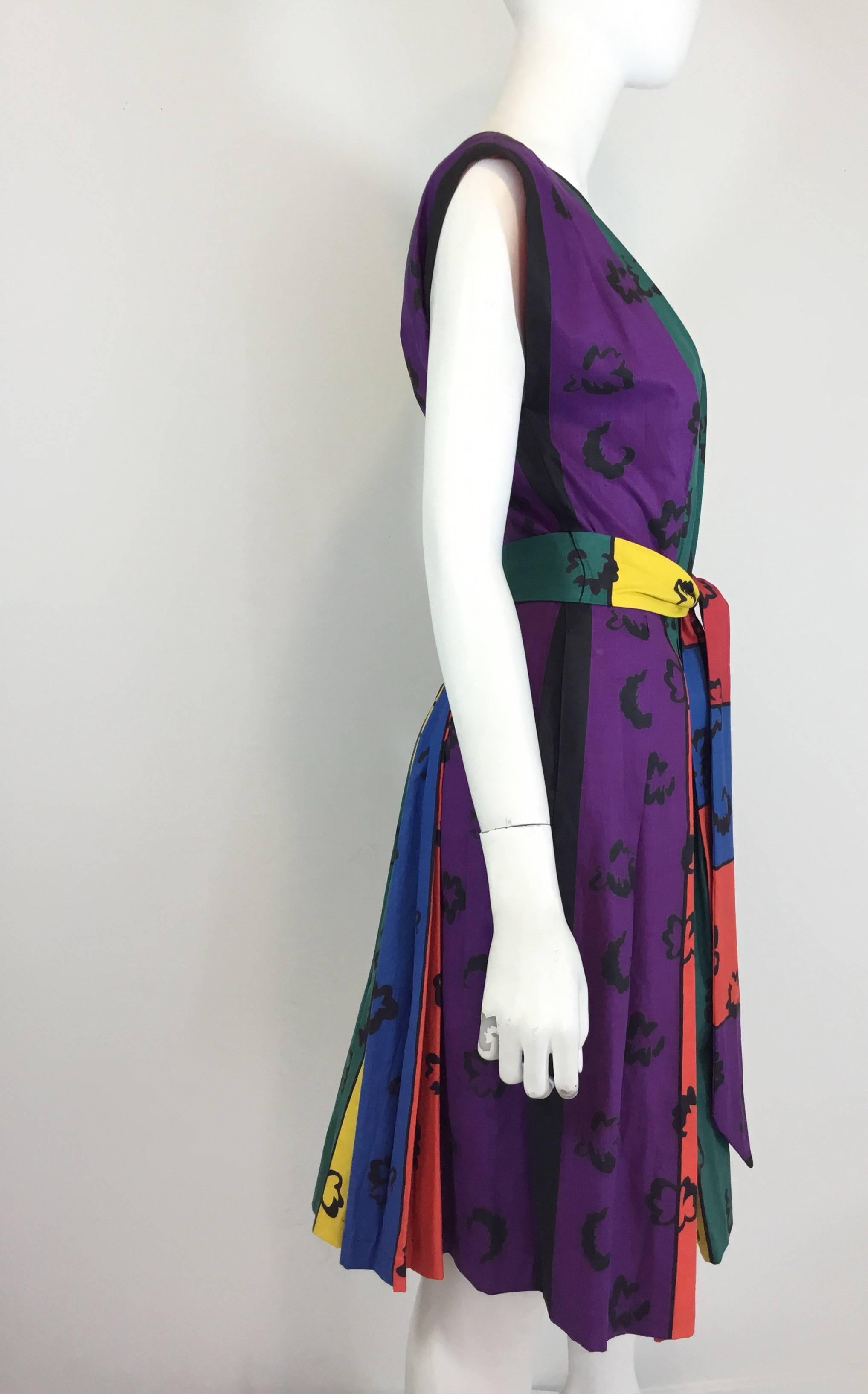 Rare Iconic Vintage Claire McCardell by Townley African Print (Book Print) Pleated Tie Waist Hook Front Dress

•Hook and eye closures along the front
•Waist tie closure
•Rainbow dress with a pleated full skirt, possibly shortened
•Excellent