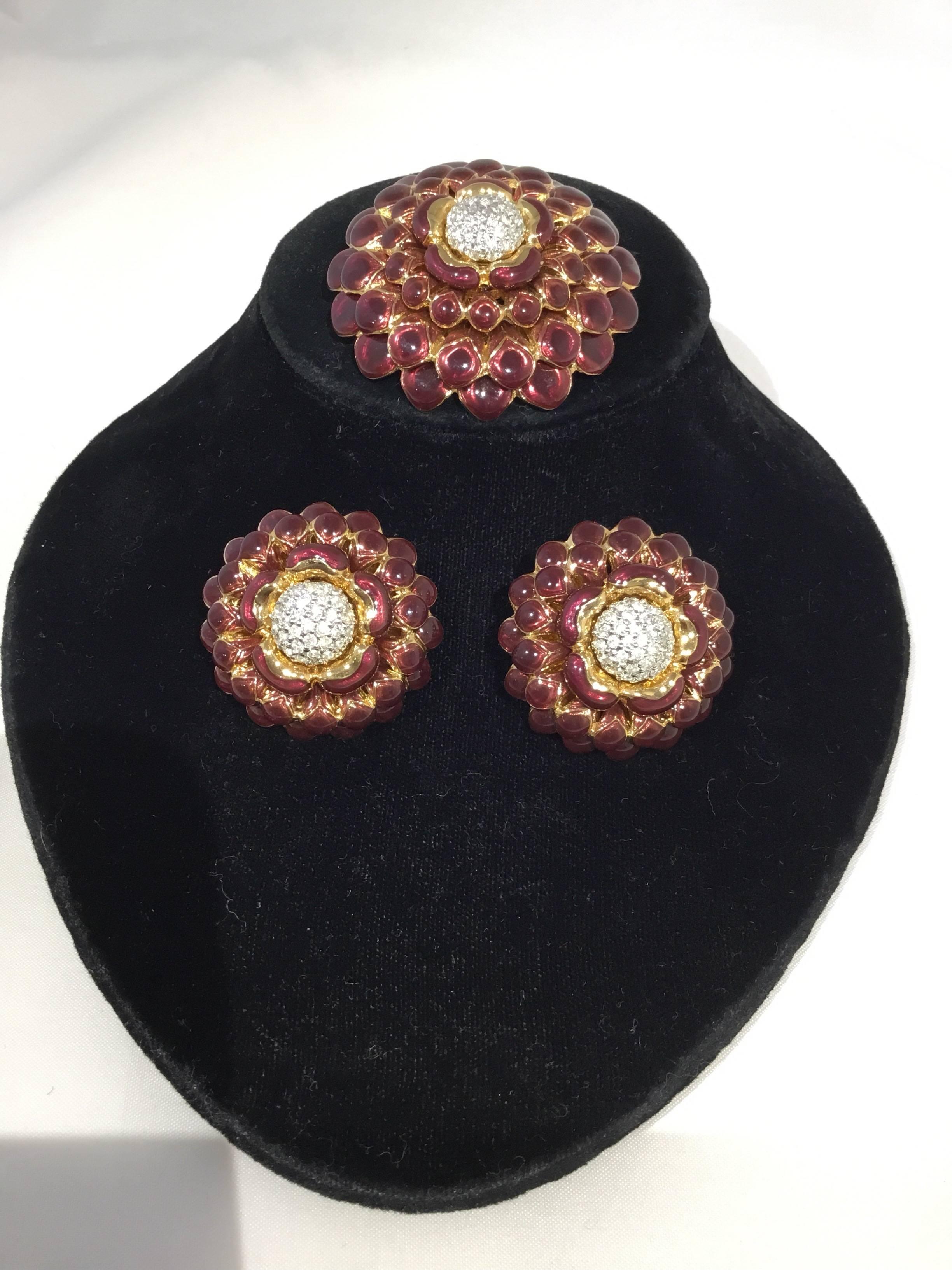 Judith Leiber brooch and earring set in burgundy enamel and gold-tone metal. Clip on earrings measure 2 '' x 2'', brooch measures 2.5'' x 2.5'' . Excellent condition.