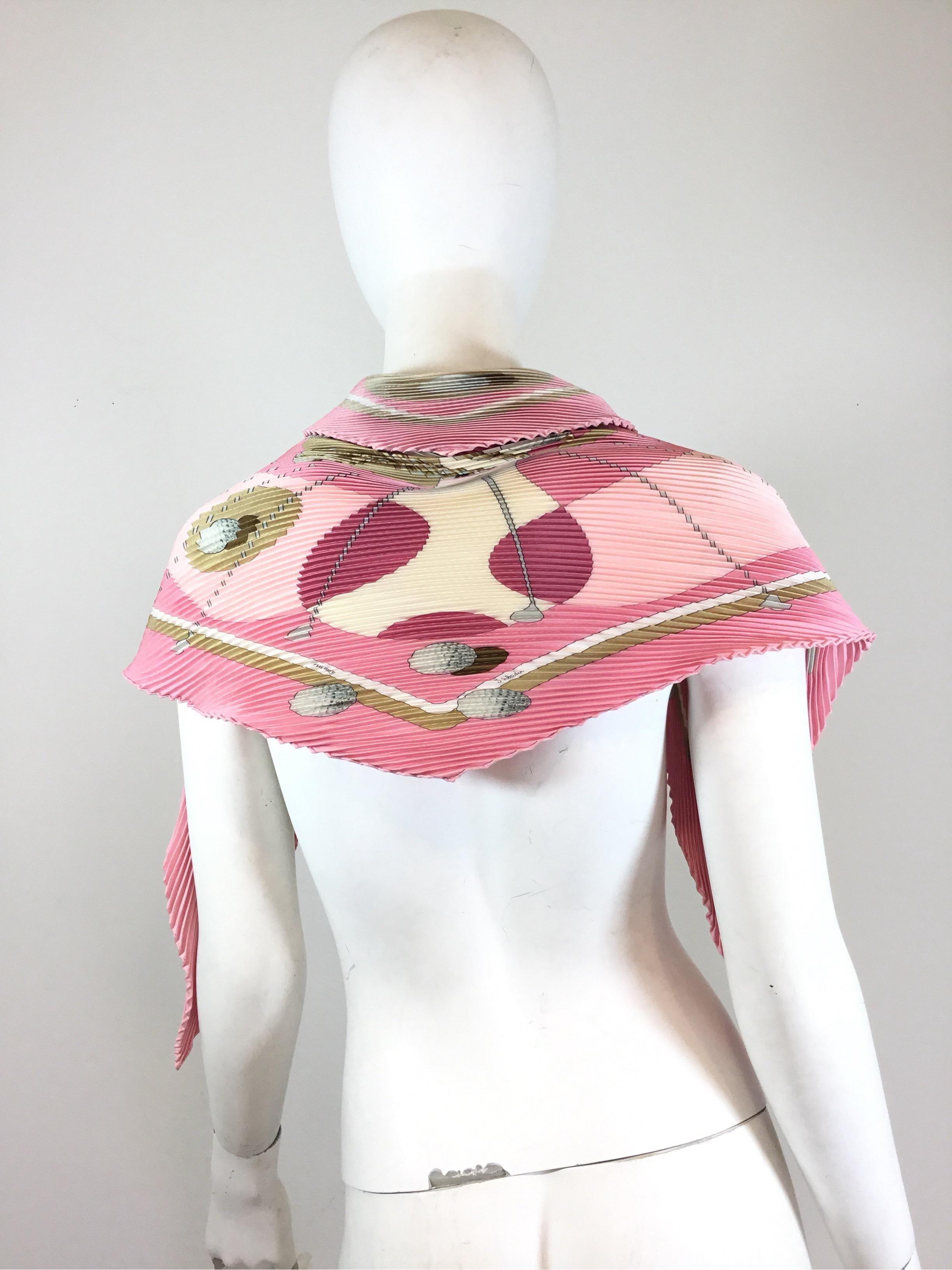 Hermes Silk plisse scarf featured in pink with gold motif. Made in France. In excellent condition, 90cm.