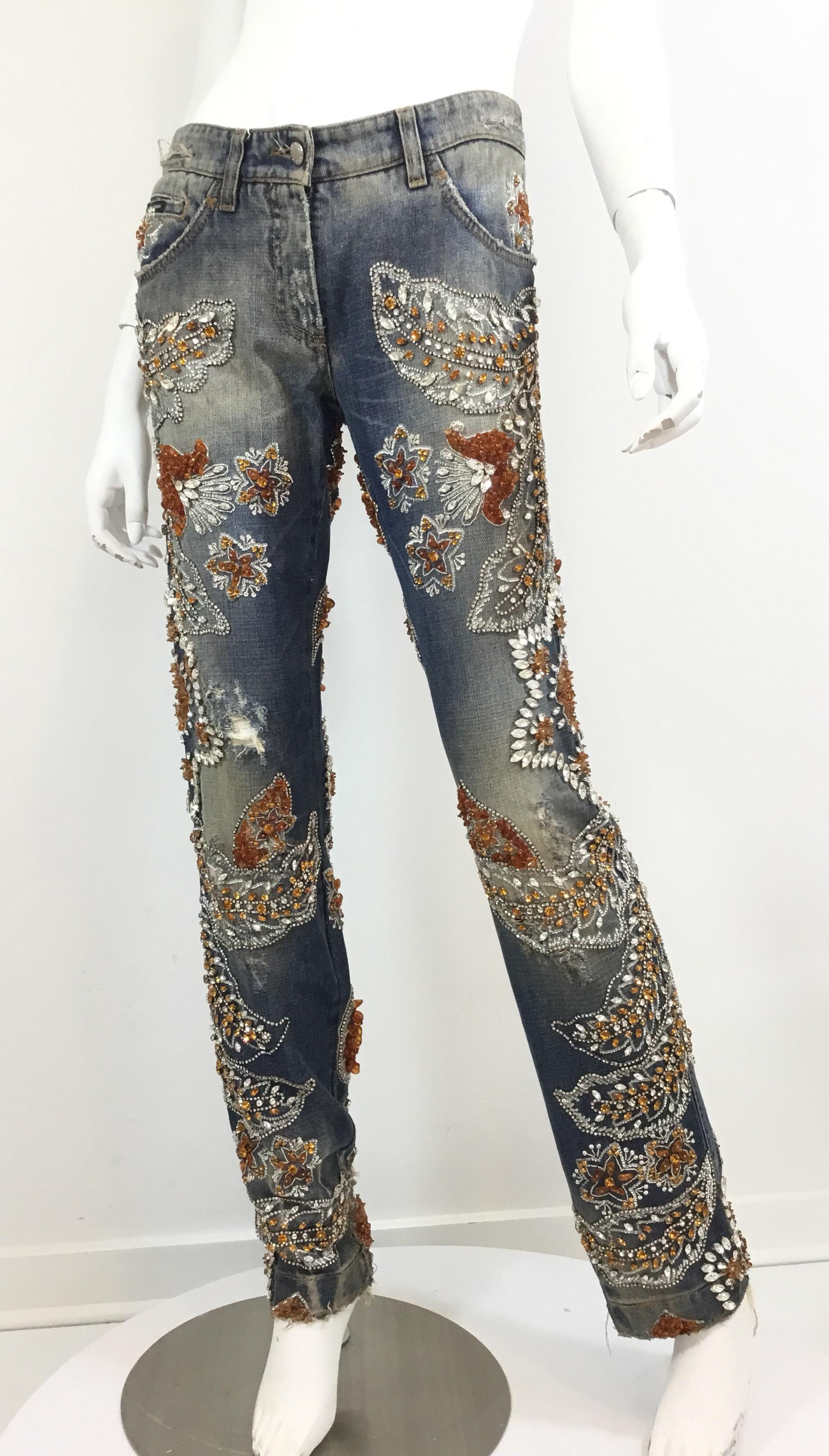 Dolce & Gabbana Jeans from Spring 2005 features rhinestone,Sequin, and bead embellishing throughout. Jeans heave funtcional front and back pockets, zipper and button fastening. Labeled Size 42, made in Italy.

Retail $20,000

Measurements:
Waist