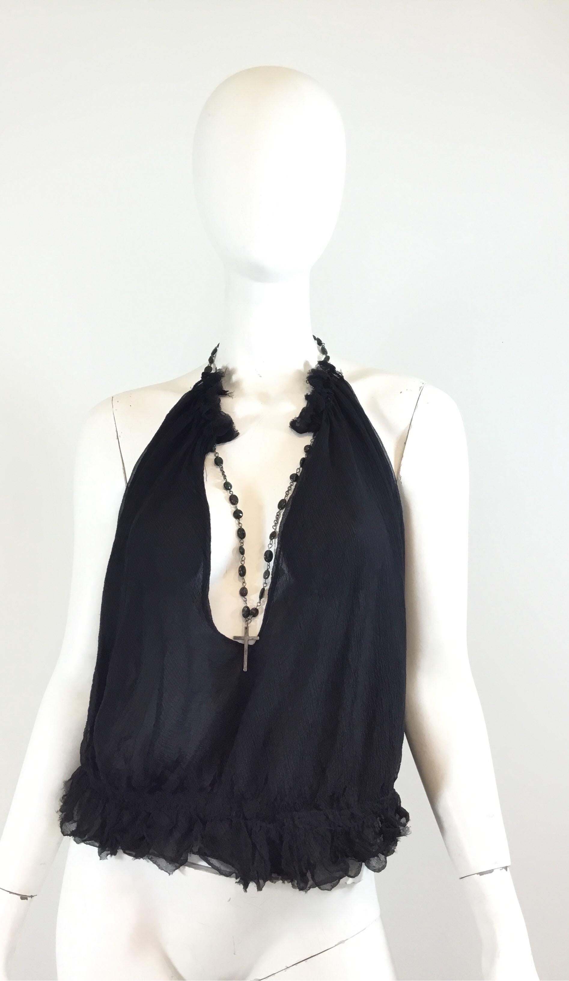 Alexander McQueen blouse featured in a black chiffon silk fabric with a bead and cross necklace detail. Top has an open back and a smocked hem with button closures. Labeled Size 44, 100% silk.

Measurements:
Bust 40” (laying flat), length 10” (Back