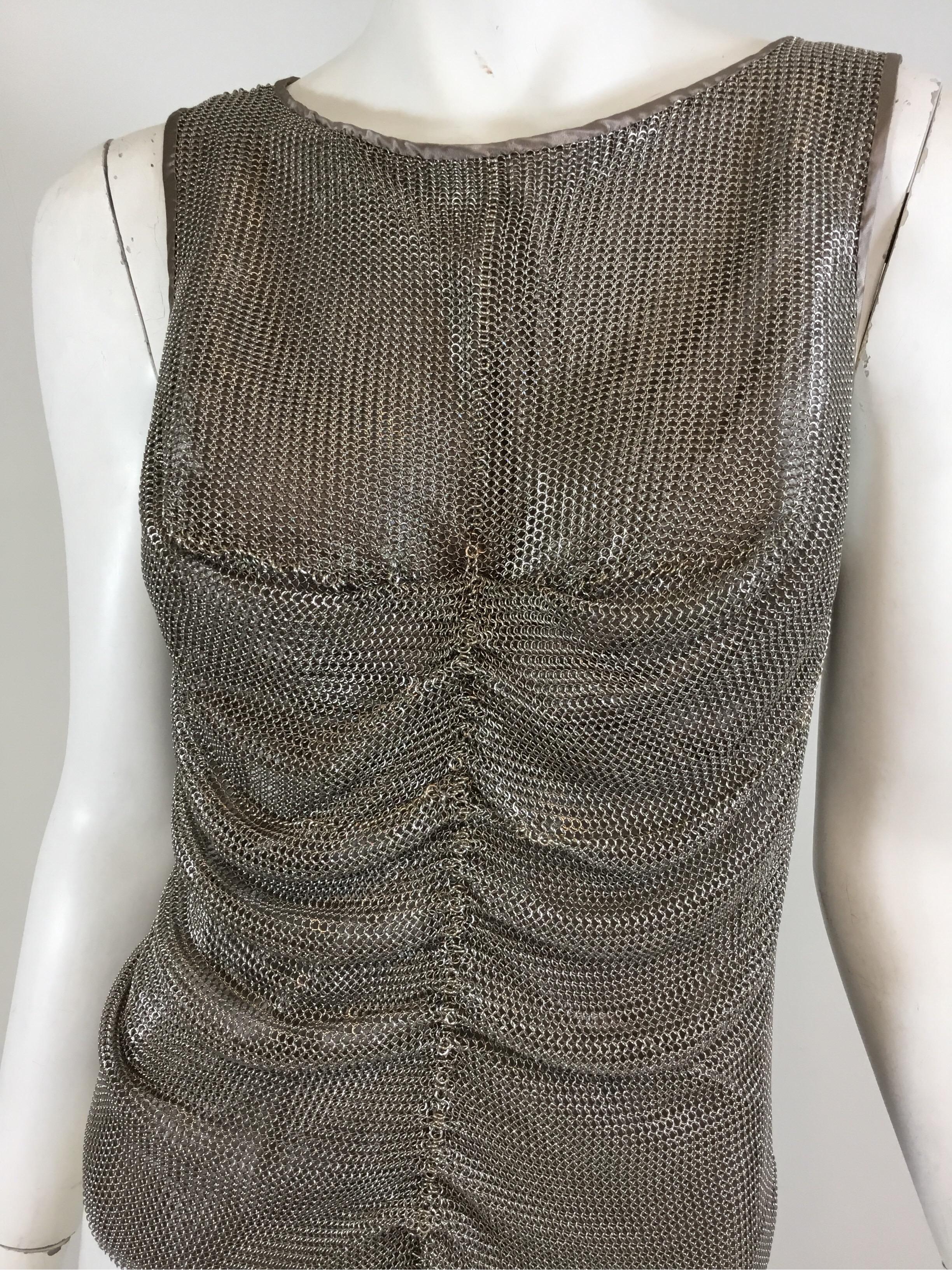 Prada Silver Metal Mesh top with a taupe under layer and full back zipper closure. Labeled Size 40, made in Italy. This top was purchased from Kim Kardashian West’s eBay auction.

Measurements:
Bust 32”, length 20”