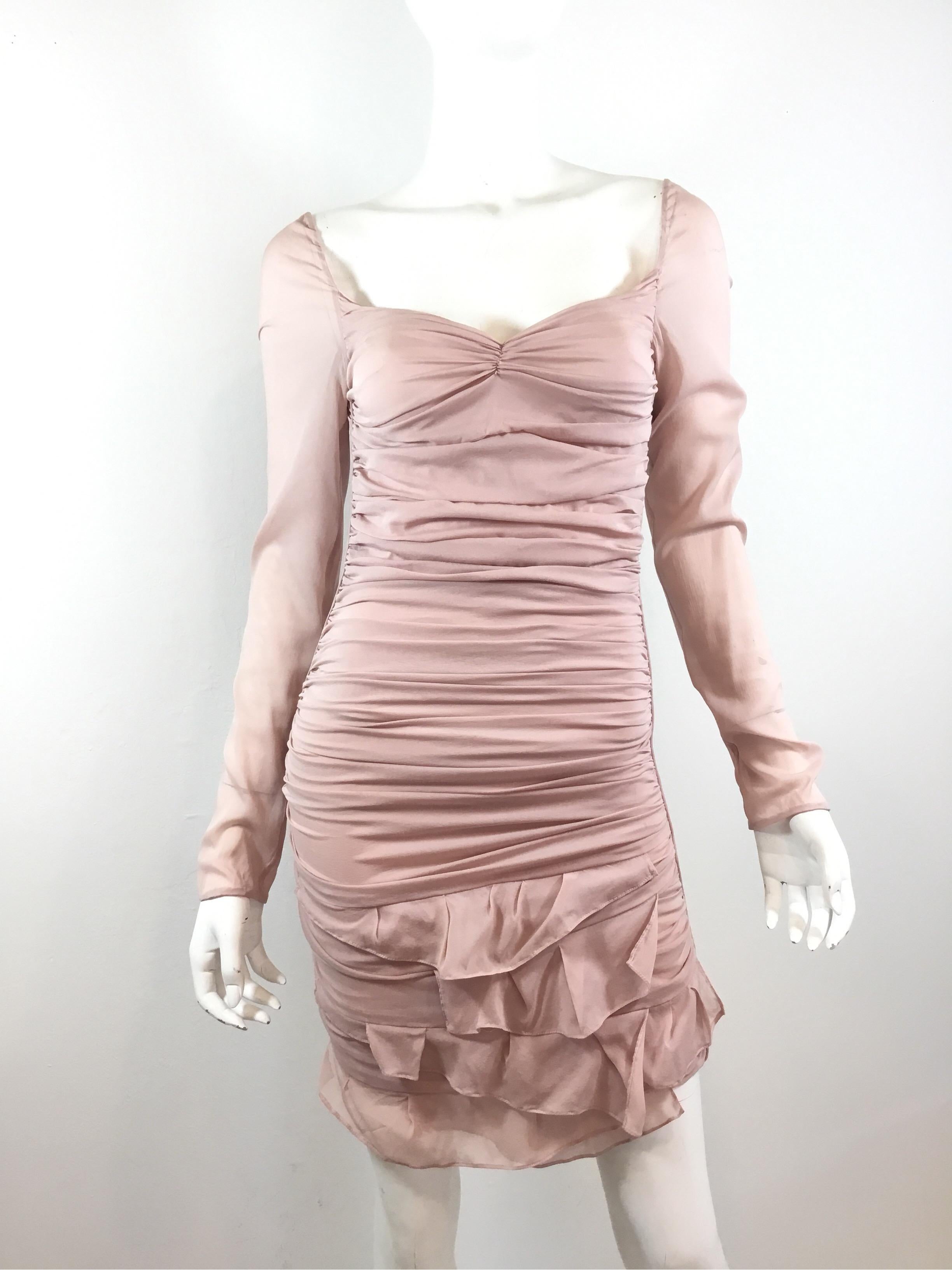 Gorgeous Runway dress from Tom Ford for Gucci’s 2003 Spring collection. Dress is featured in a nude pink color, composed of  a silk and spandex blend, labeled Size 38, made in Italy. Dress has an open back with strappy detail across the back and a