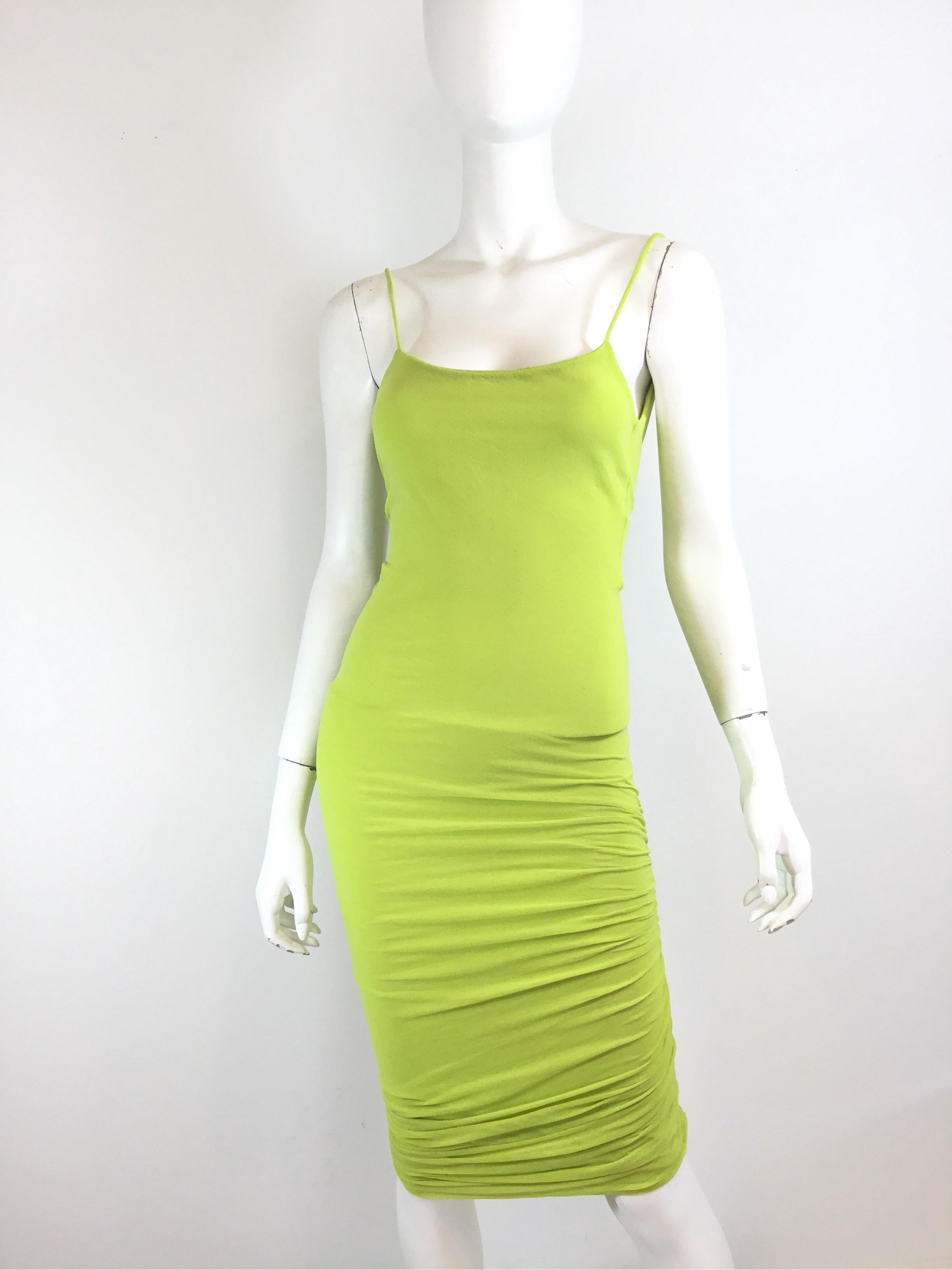 Giorgio di Sant Angelo dress featured in a bright green color, stocking knit fabric which gives the dress a fitted and ruched design. Fully lined. Dress is small with some stretch to the fabric. Measurements are as follows:

Bust 26”, waist24”, hips