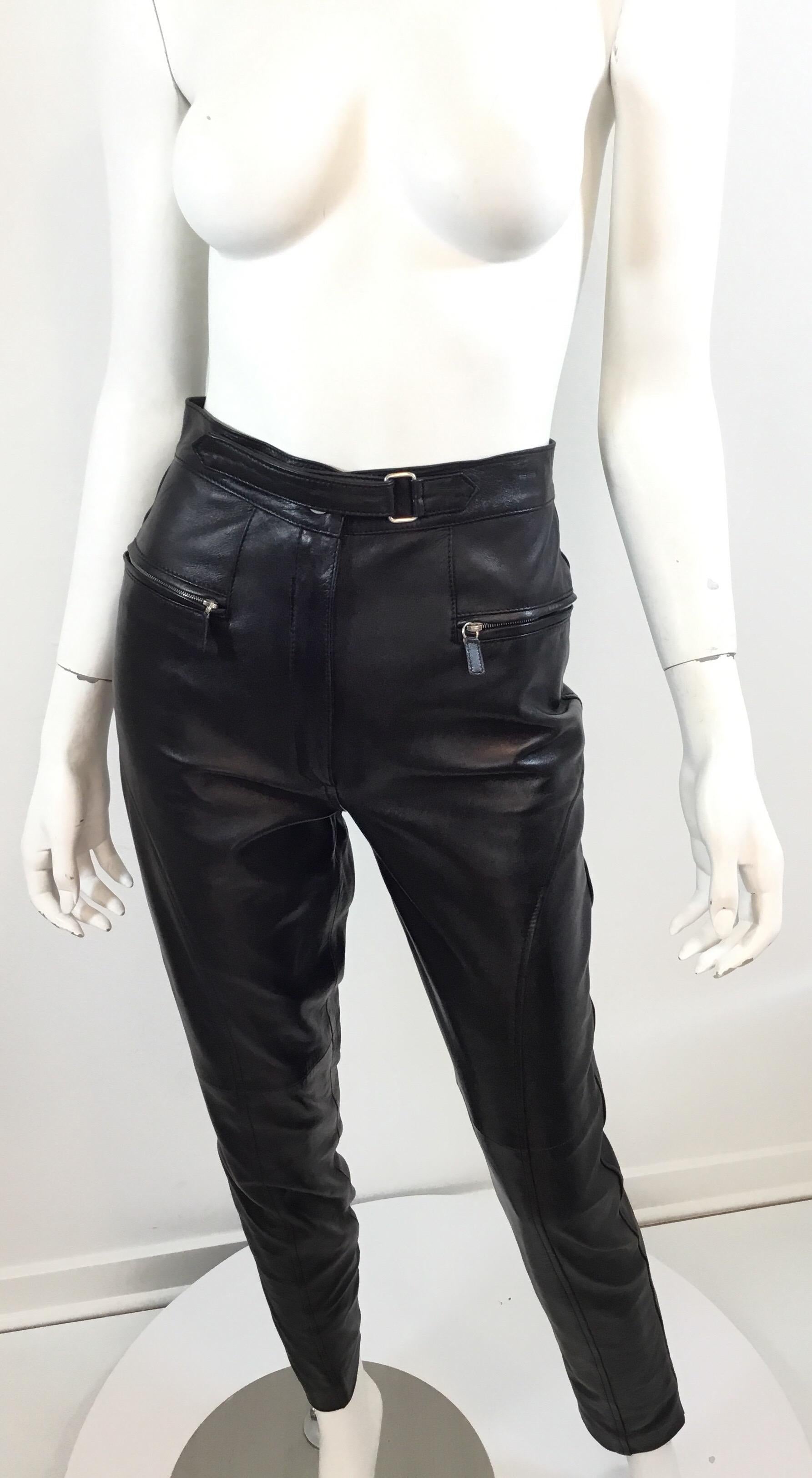 Tom Ford for Gucci black leather pants are featured in a size 40 and fully lined. Pants have a button, zipper closure, and a Velcro Strap. Two functional zipper pockets at the front with silver hardware. Excellent condition.

Waist 25”, hips 34”,