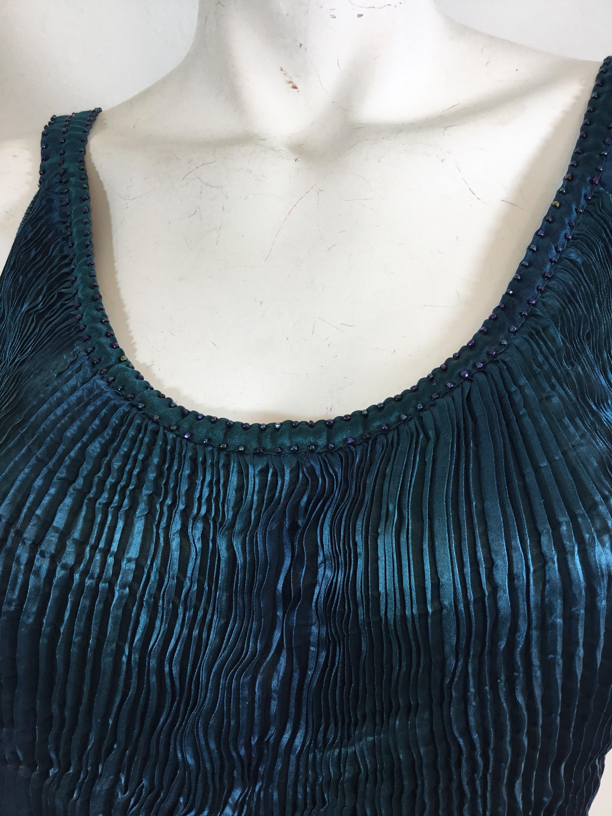 Beautiful Charles Patricia Lester top with bead detailing along the neckline, pleated silk throughout and a frilled hem. 100% silk. 

Bust 30” (with room for expansion due to pleated design), length 18” 