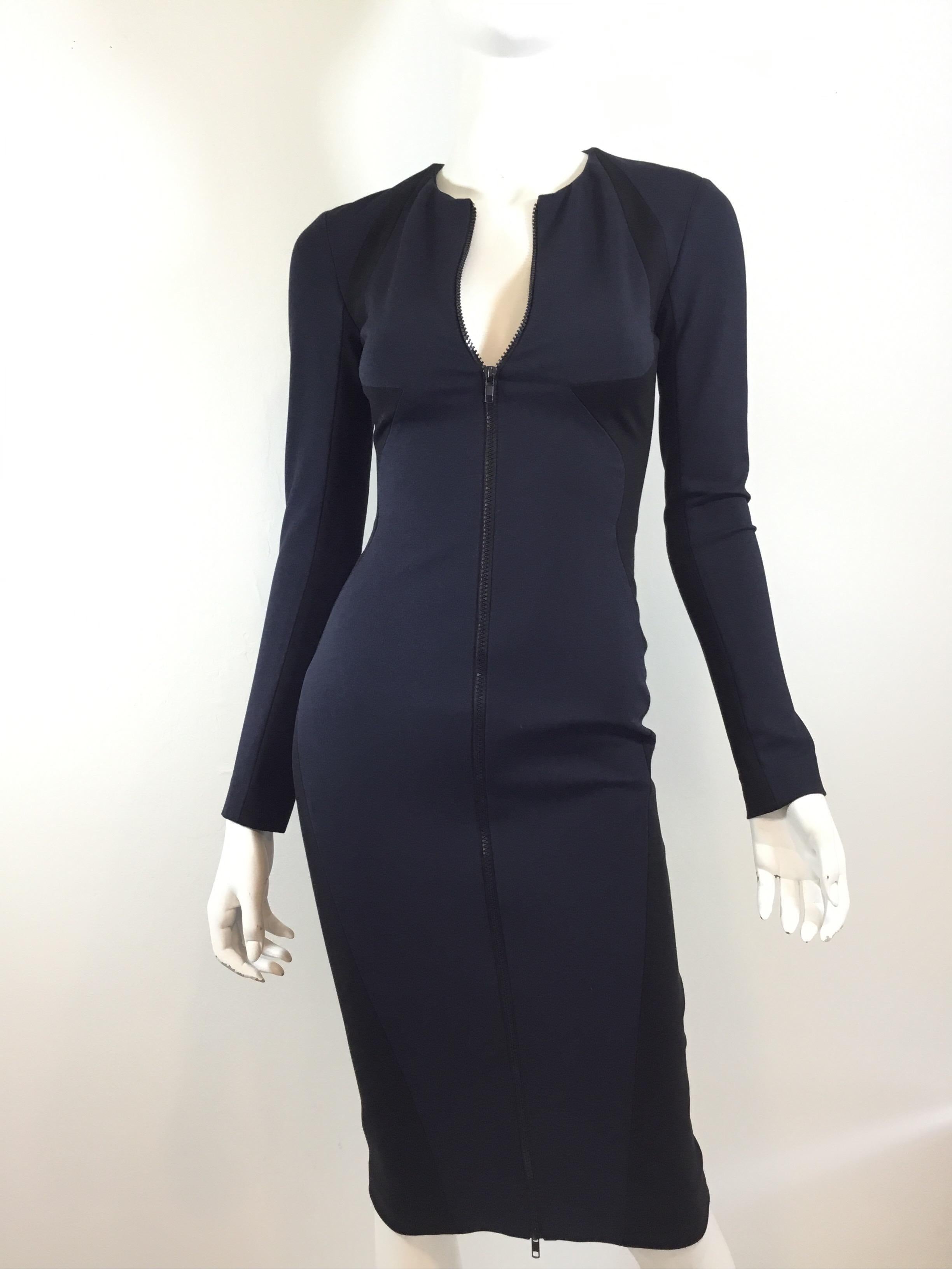 Cushnie Navy and Black Bodycon Dress with a full zippered front closure and a satin silk lining. Dress is a size 2. Excellent condition.

Bust 30''
Waist 34''
Hips 30''
Sleeves 20''
Length 41''
*stretchy fabric*