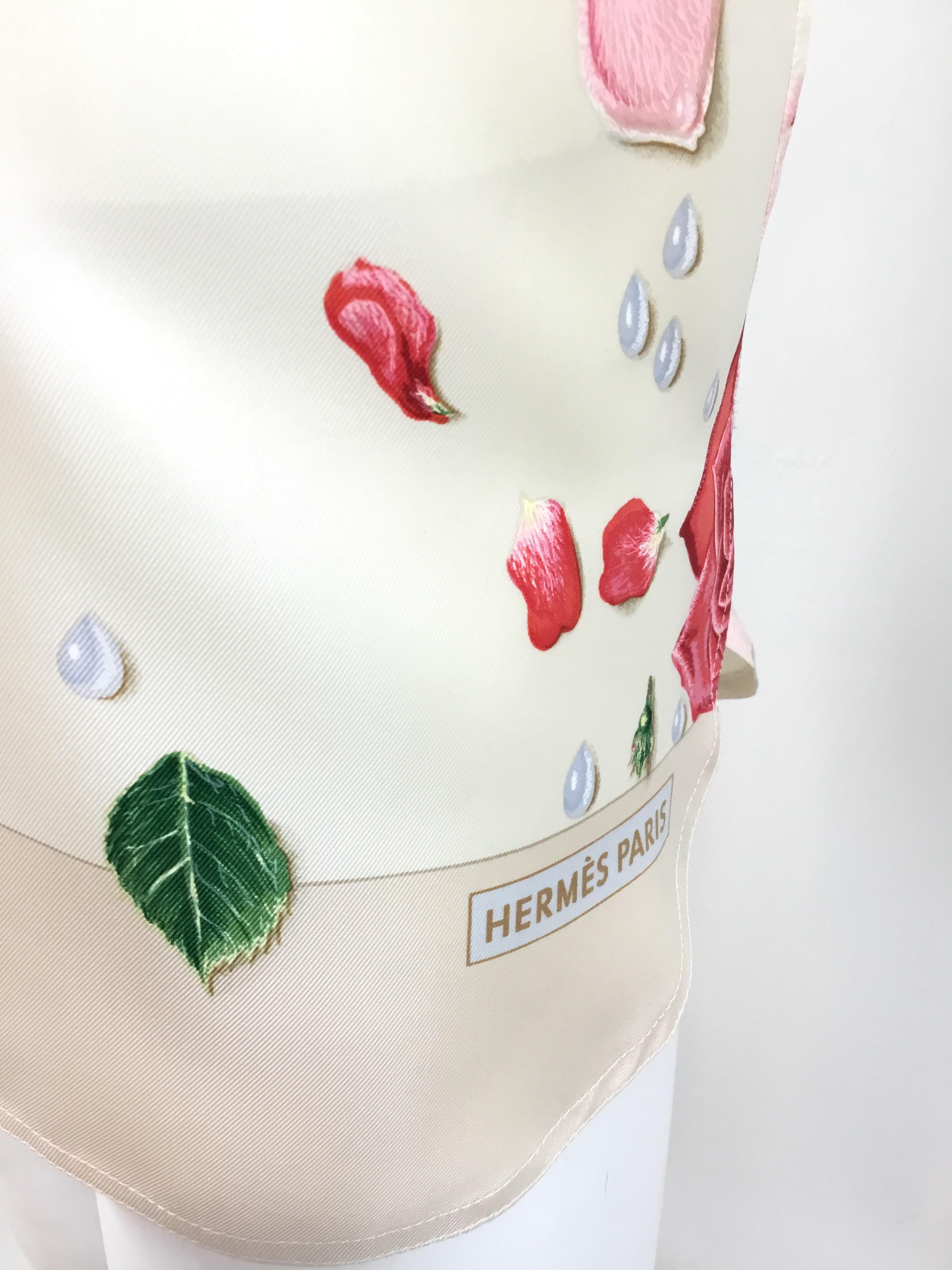 Hermes floral silk blouse on an ivory-colored background with button closures along the front and on the cuffs of the sleeve. Blouse is a size 38, 100% silk, made in France.

Bust 40''
Sleeves 23''
Shoulder to shoulder 17''
Length 31''