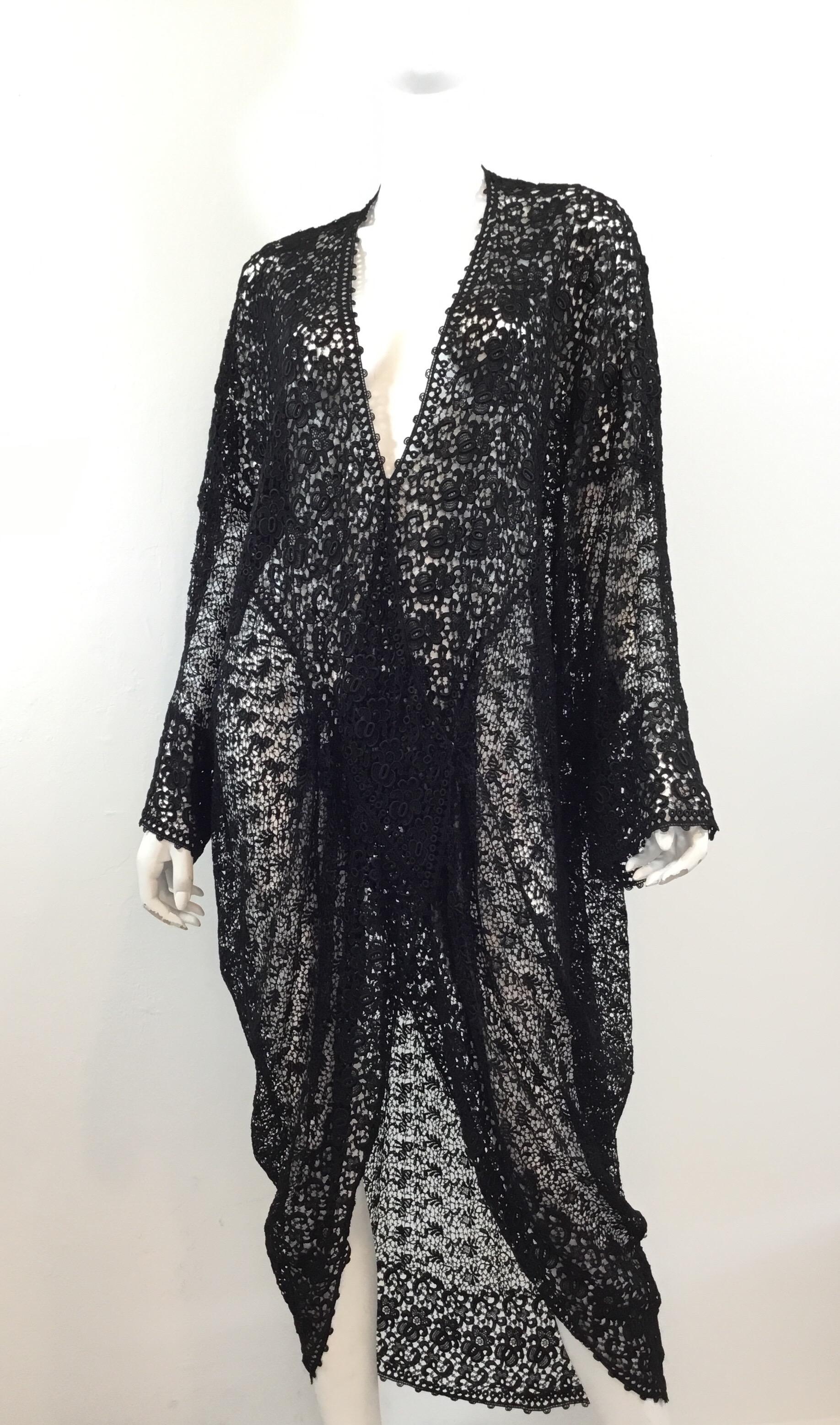 Beautiful Victorian lace cover up with snap closures carefully placed along the draped front. Cover up has some tearing due to the delicate fabric and aging. 

Bust 80” (40 inches across laying flat), length 52”
