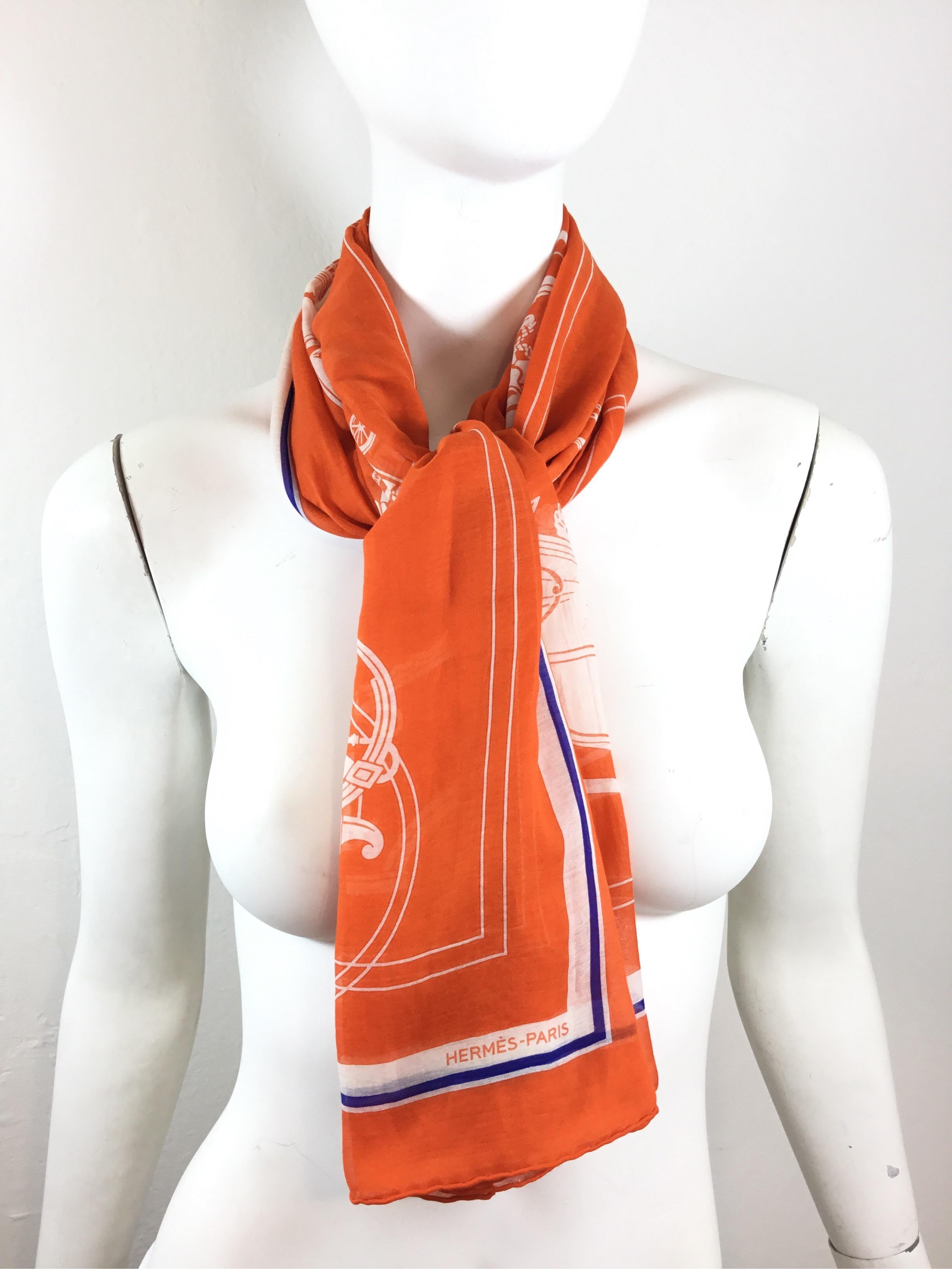 Hermes Orange Silk and cotton blend scarf with a white and navy blue border. Scarf is made in France and measures approximately 175 x 62 (cm)

Excellent condition.