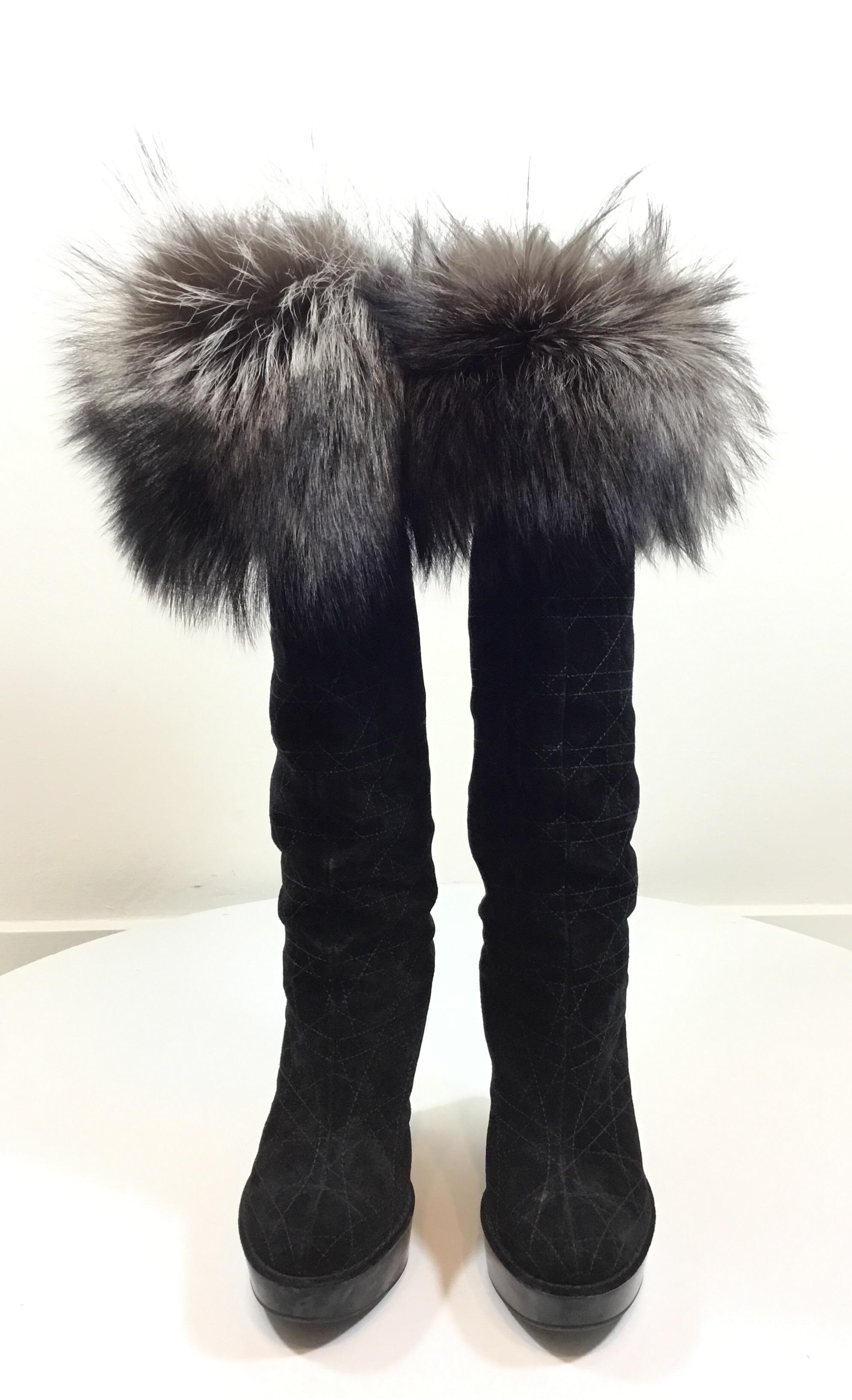 Christian Dior suede boots designed with a Cannage quilt and fox fur trims. Boots are also embellished with crystal D charms on the counters and have a wedge heel measuring approximately 4.5 inches. Size 37, made in Italy. 