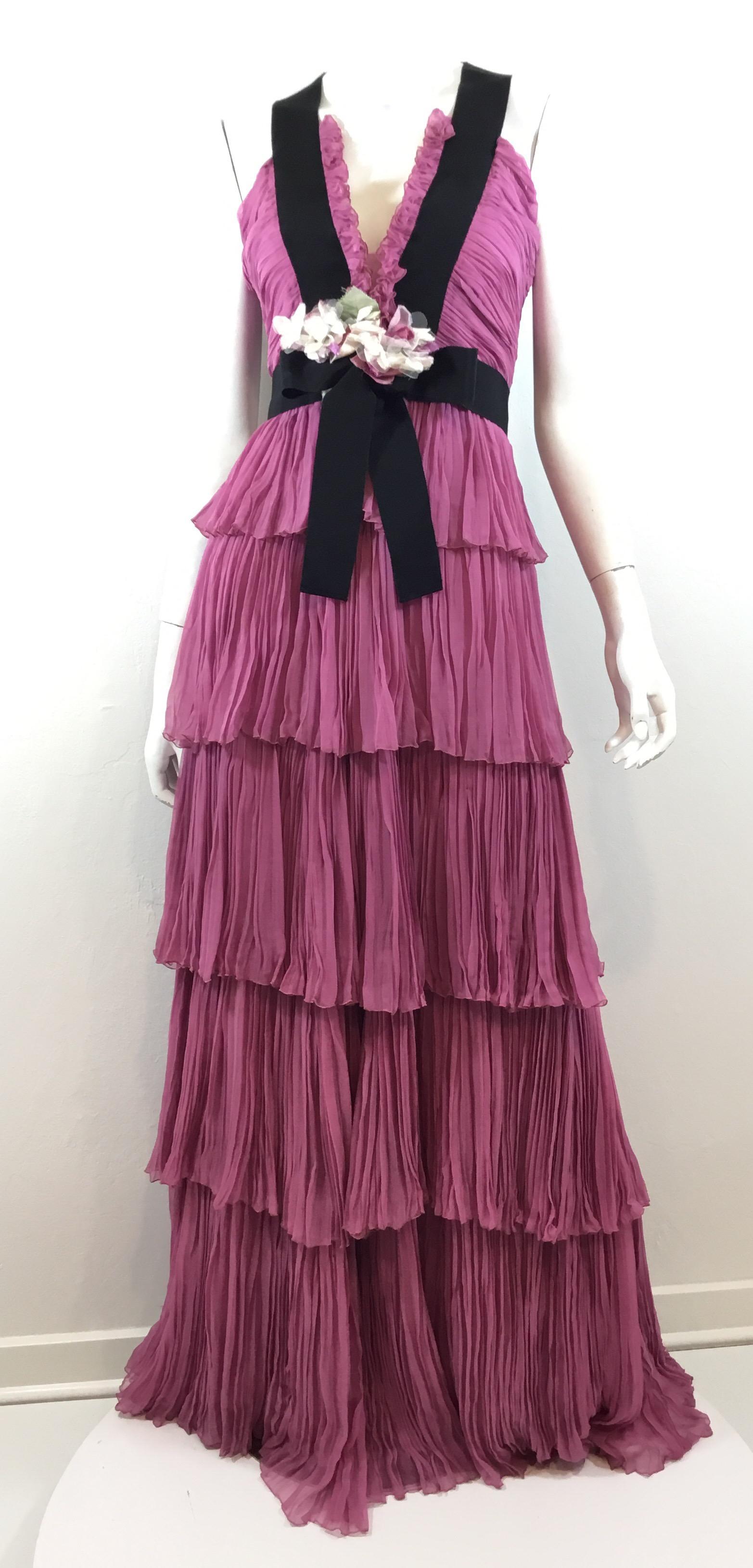 Gucci tiered silk chiffon gown from Gucci's Resort 2016 collection designed by 2016 CFDA designer of the year, Alessandro Michele. Gown features a lavender-lilac color with a floral applique and faille ribbon tie and trim along the waist and