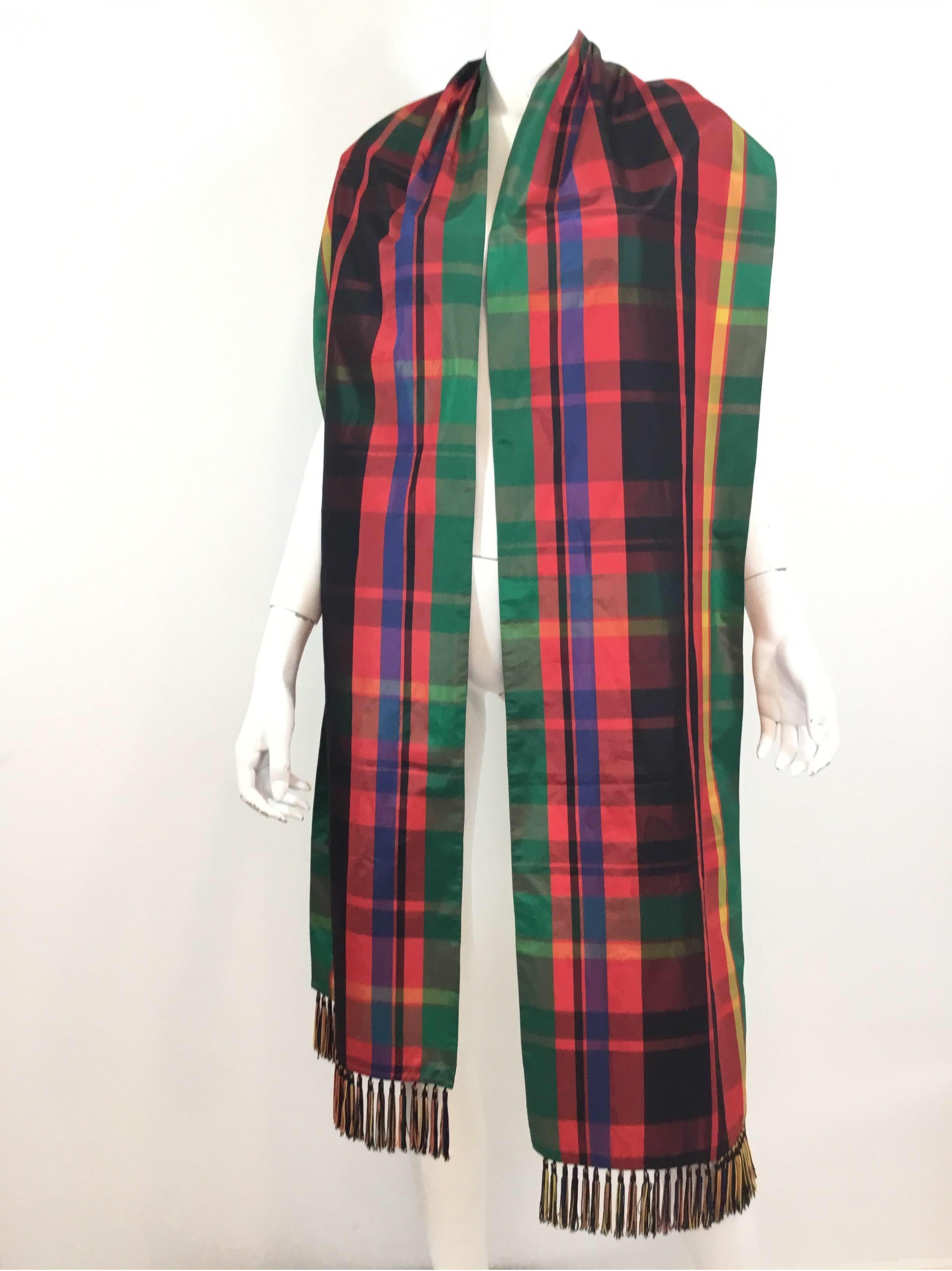 Yves Saint Laurent Vintage scarf/shawl in a tartan pattern design, taffeta fabric with fringed ends. 100in. Long, 13in. wide. Made in France. Some water spots on the taffeta fabric as pictured.