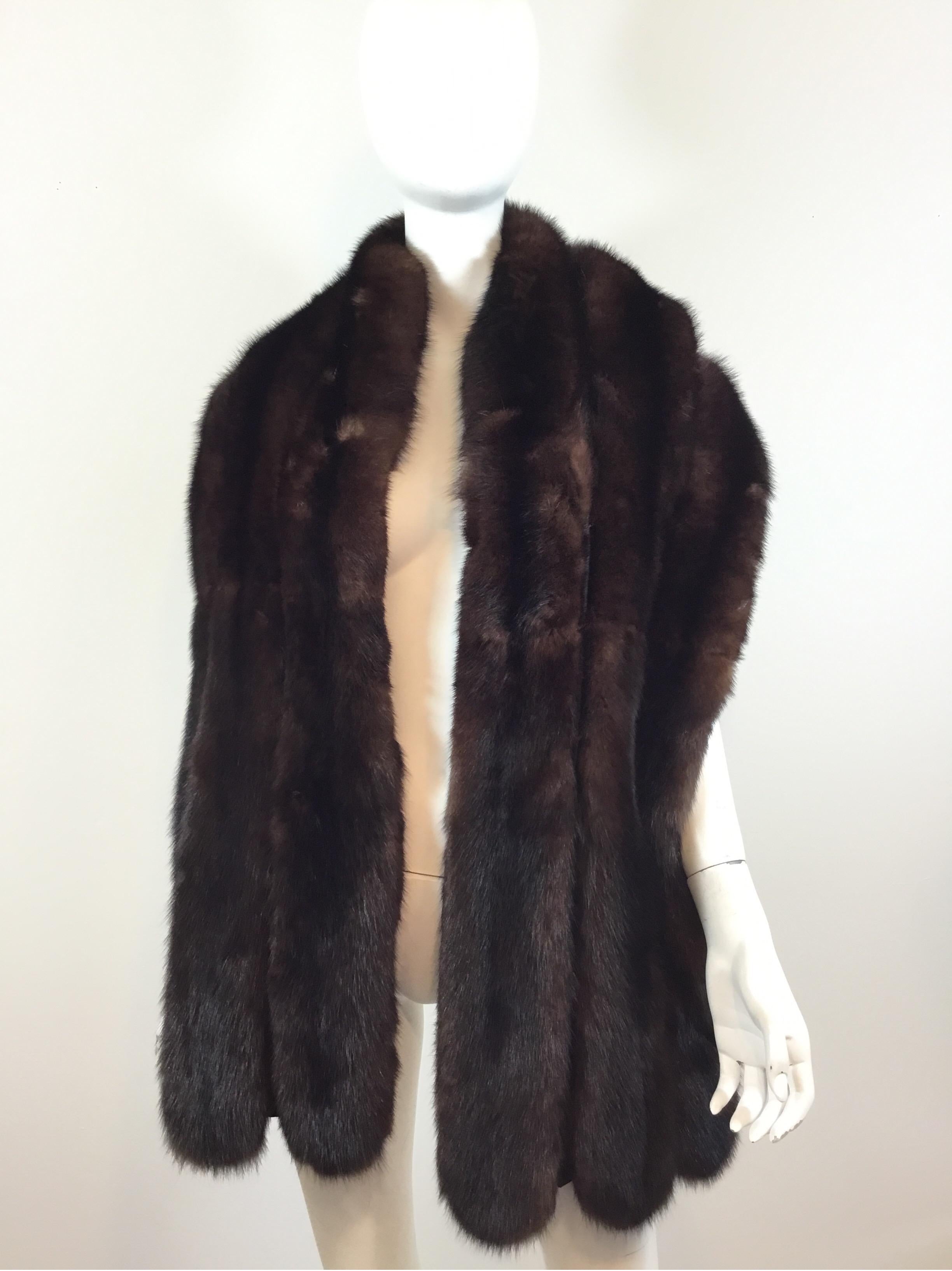 Sable Fur Shawl featured in brown with a scalloped hem and full lining. Shawl is approximately 73 inches long and 12 inches wide. Excellent condition. 