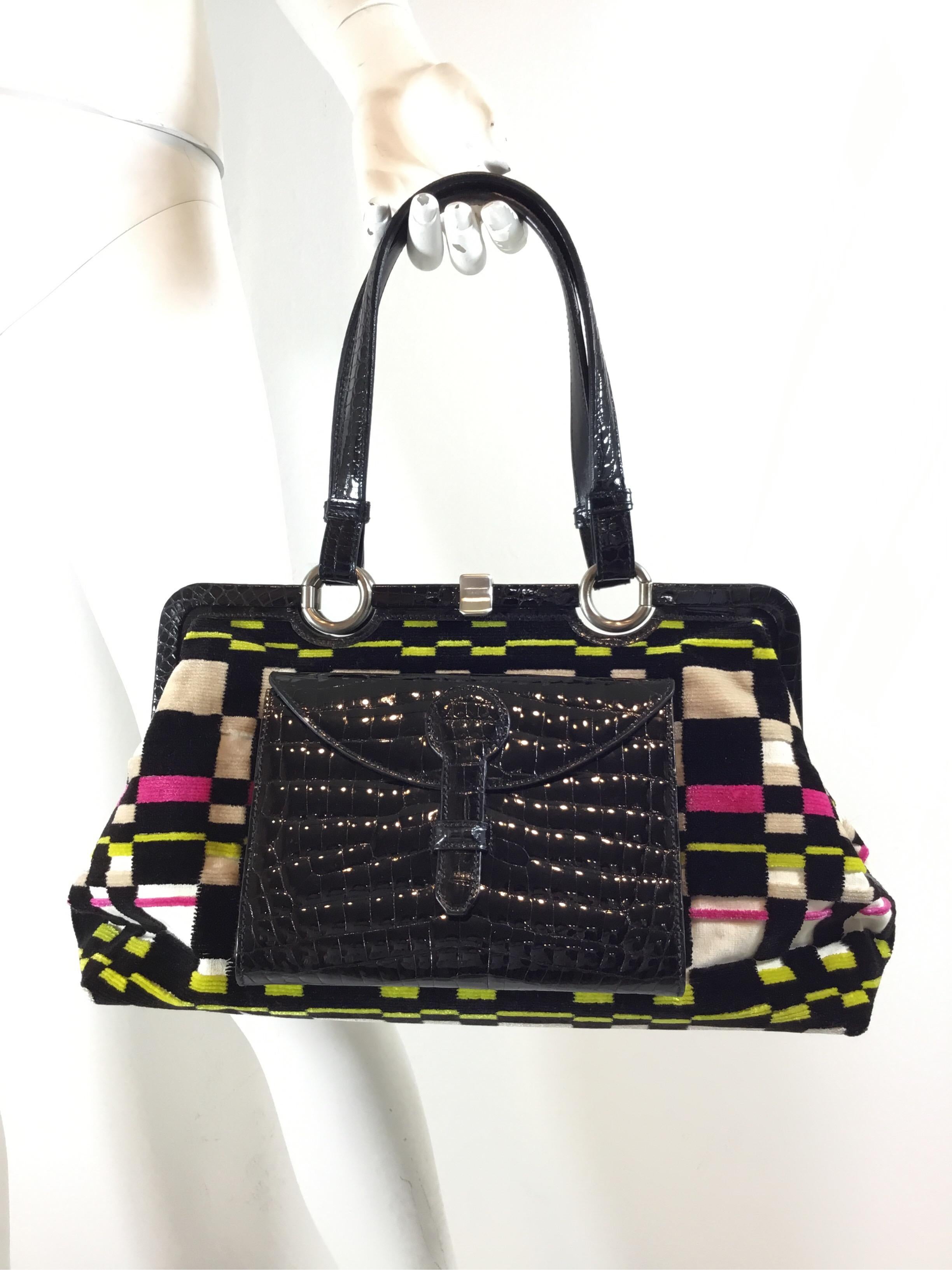 Bottega Veneta handbag features a Multicolor terry clotch/velvet fabric with black patent crocodile trimming and front pocket. Handbag has a frame opening and two flat top handles attached by silvertone hardware. Full leather lining. Made in Italy.
