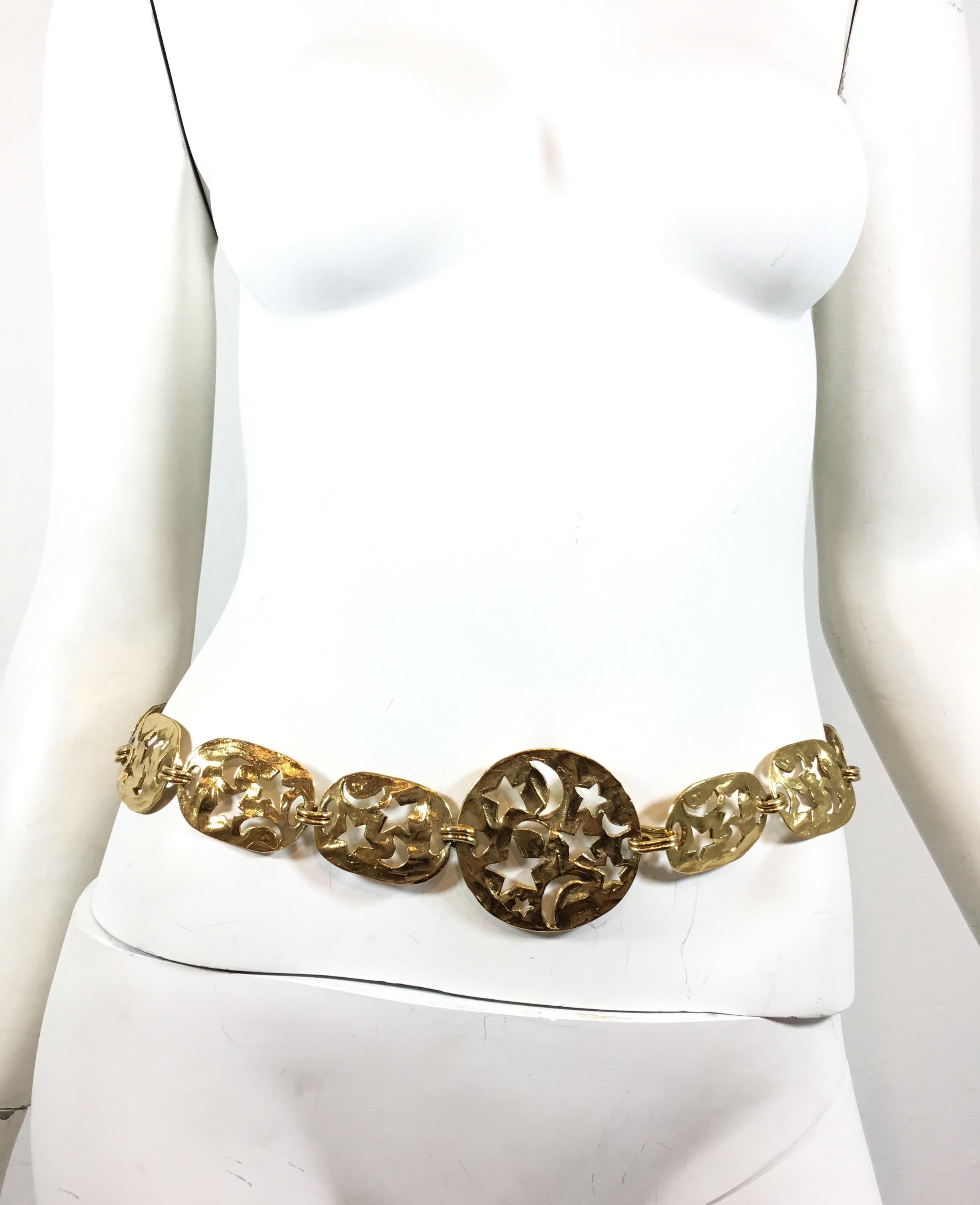 Yves Saint Laurent Gold chain belt with cutout stars and moons throughout. Belt measures approximately 29” Long, plates are 1.5 inches wide with the largest being 2.5” x 2.5”. Hook closure.

Excellent condition!